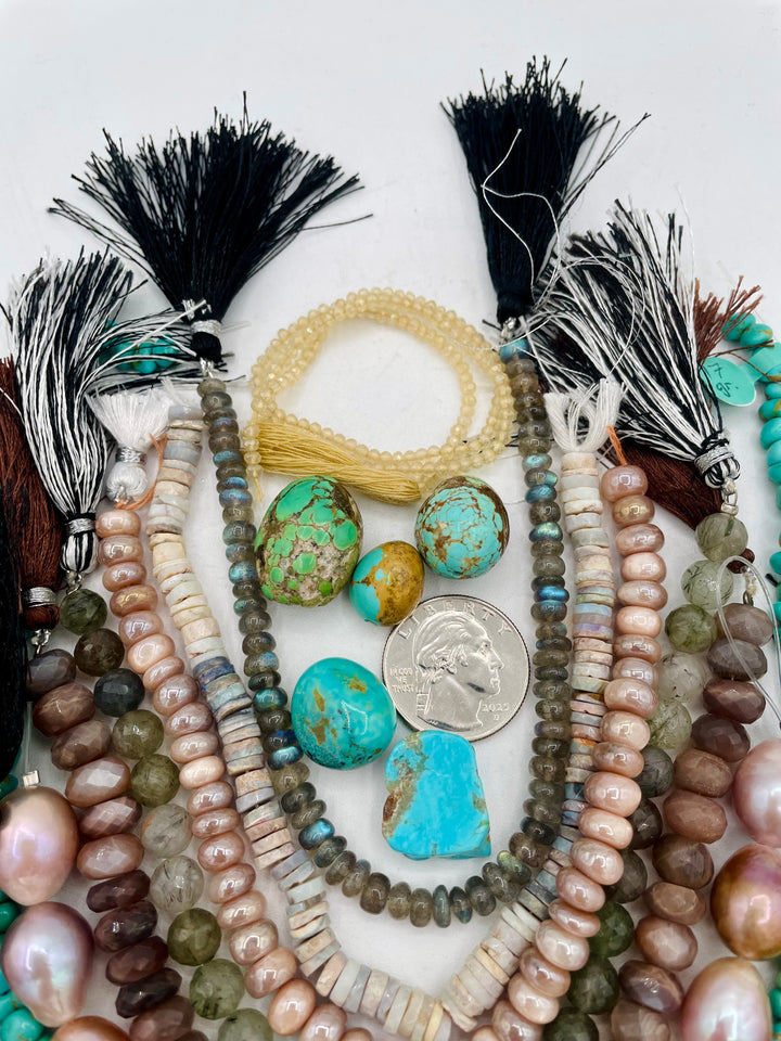 Curated bead box featuring Sonoran turquoise, Kingman turquoise, Hubei turquoise, #8 turquoise, high grade pearls, labradorite, quartz, and moonstone.  143 grams of turquoise. Includes strands and pendent sized nuggets. U.S. quarter for size reference. Available only from Rockstar Cowgirl online or in store in Cody, Wyoming.