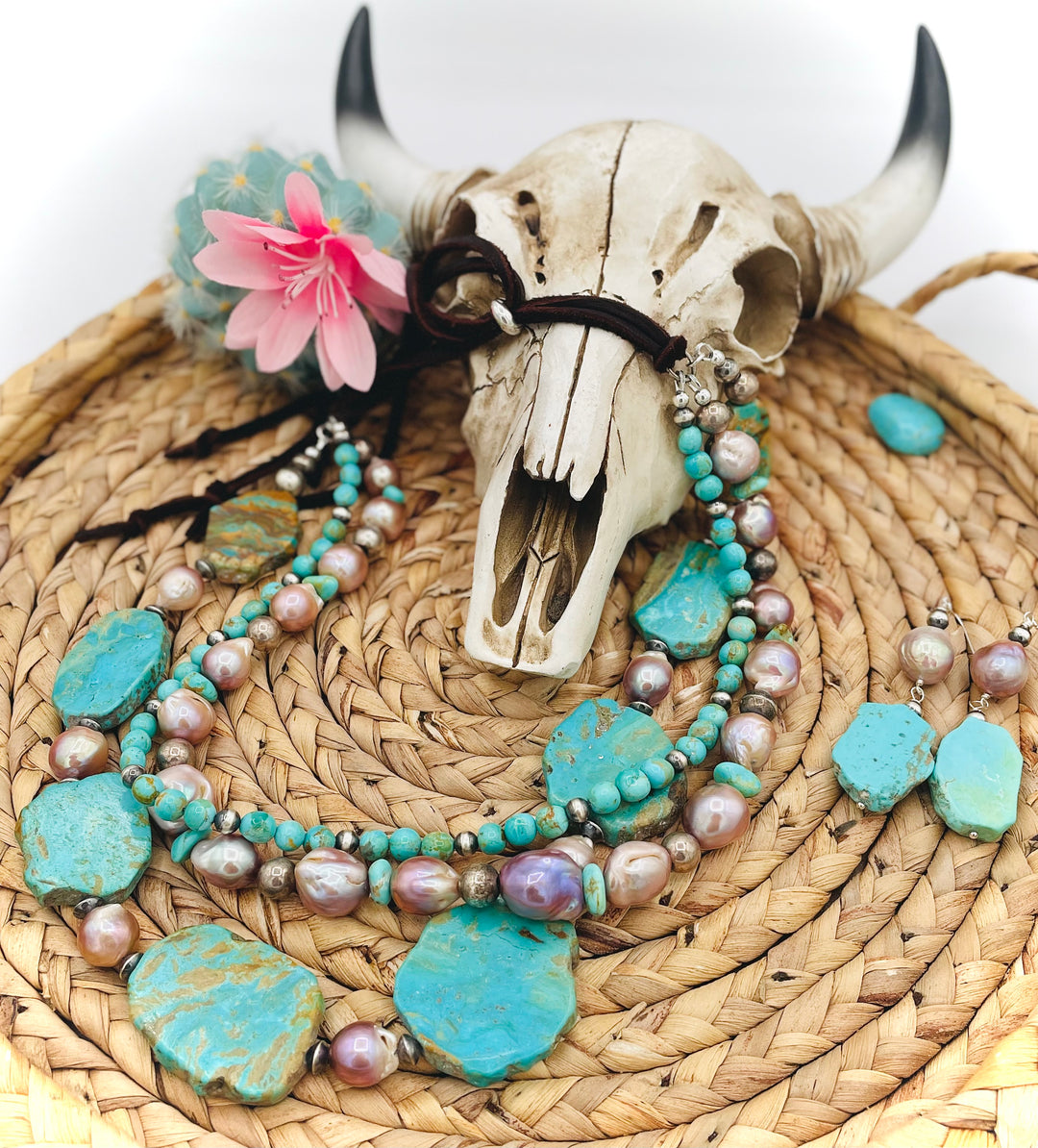 Beaded three strand necklace featuring Kingman turquoise, natural luster pearls, sterling silver beads, and finished with deer lace and slide bead. Includes matching earrings. Available only from Rockstar Cowgirl online or in store in Cody, Wyoming.