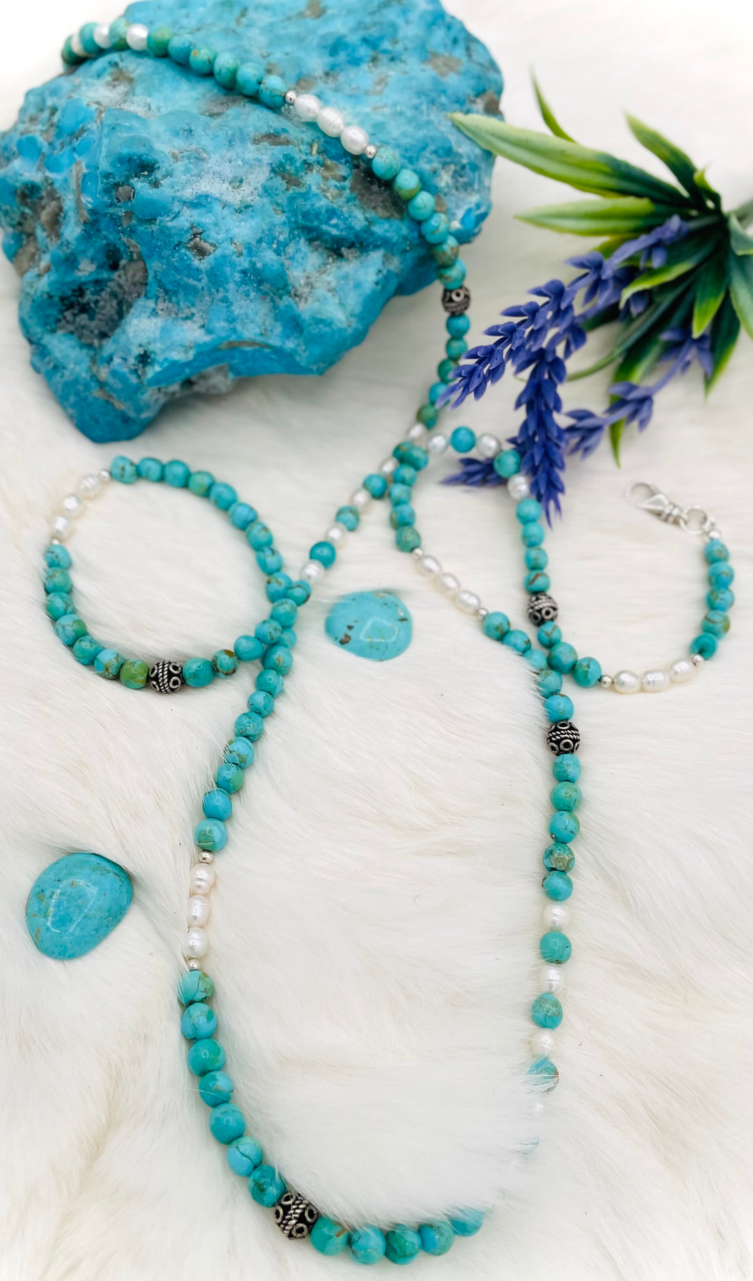 Beaded invention necklace featuring Kingman turquoise, freshwater pearls, sterling sliver accent beads, with sterling silver swivel lobsters, eye glasses loops, and cell phone case attachment bracket. Available only from Rockstar Cowgirl online or in store in Cody, Wyoming. 