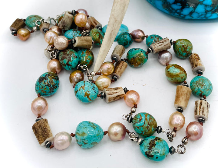 Silk knotted and wire wrapped treasure necklace with two nested strands featuring Kingman turquoise nuggets, deer antler beads, Edison natural luster pearls, and sterling silver beads. Available only from Rockstar Cowgirl online or in store in Cody, Wyoming.