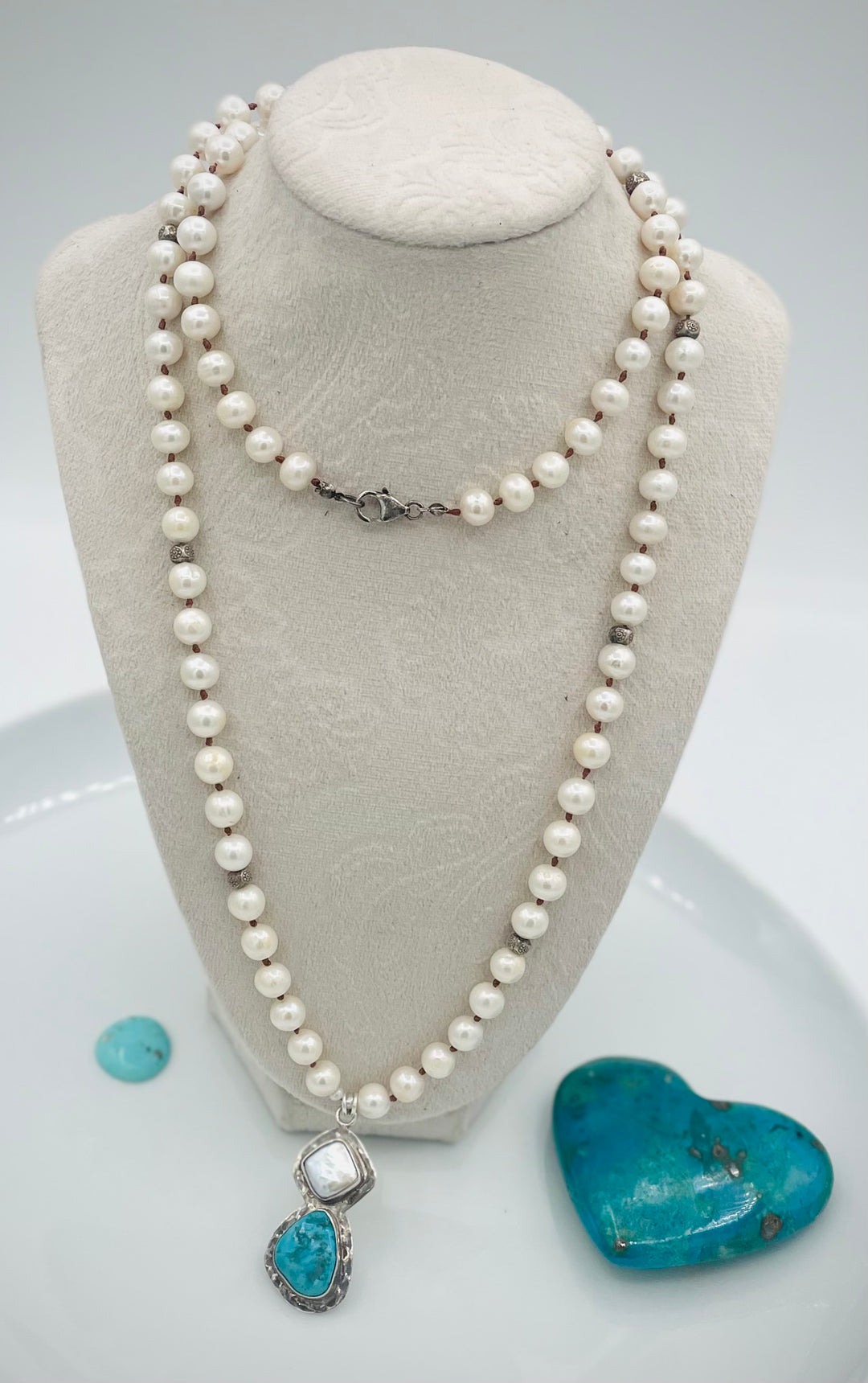 Silk knotted long necklace featuring white pearls, and sterling silver beads with a pearl and turquoise sterling silver pendent. Available only from Rockstar Cowgirl online or in store in Cody, Wyoming.