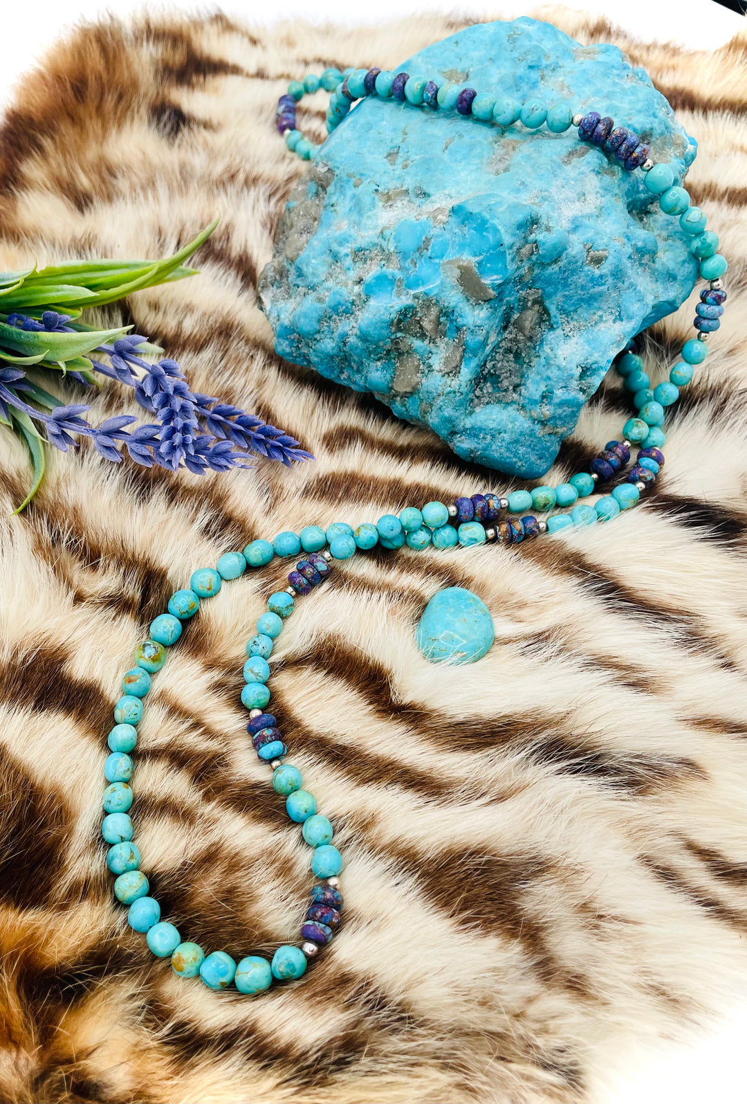 Beaded invention necklace featuring Kingman turquoise, purple Mojave turquoise, sterling silver beads, sterling silver swivel lobsters, eye glasses loops, cell phone case attachment bracket. Available only from Rockstar Cowgirl online or in store in Cody, Wyoming.