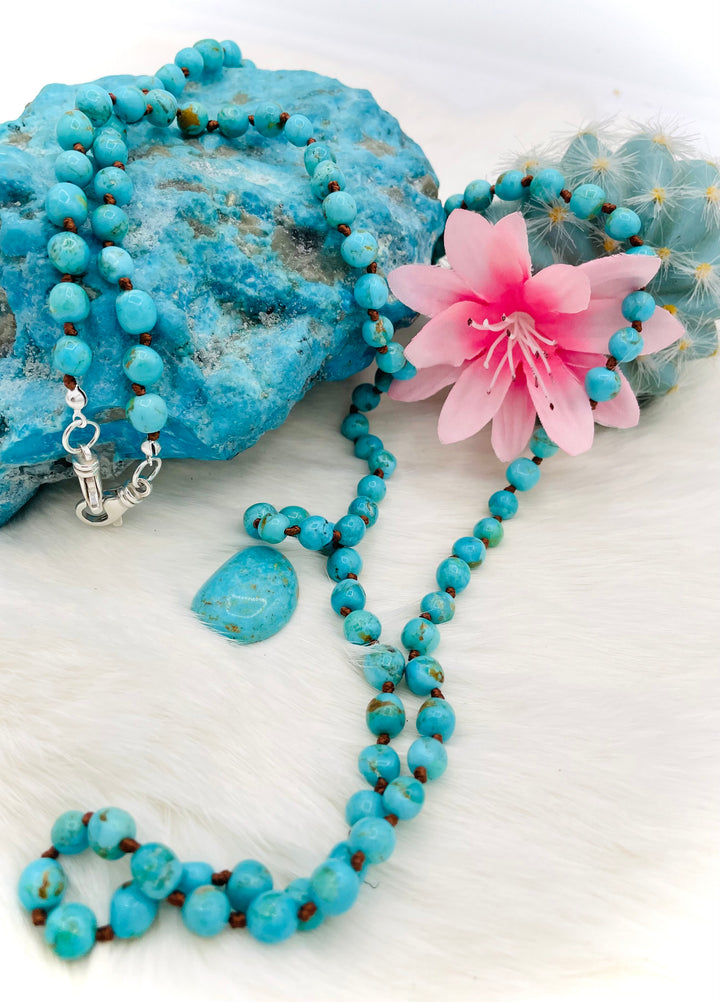 Silk knotted Kingman turquoise necklace, phone holder strap, or eyeglass holder featuring sterling silver swivel lobsters for various attachments or uses. Comes with phone case attachments and eye glasses loops. Available only from Rockstar Cowgirl online or in store in Cody, Wyoming.