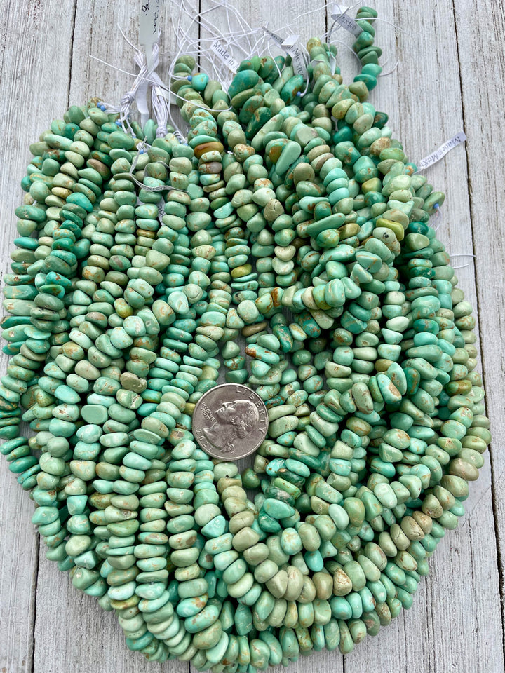 Green Alacran turquoise center drilled nugget strands sold individually. U.S. quarter for size reference. Available only at Rockstar Cowgirl online or in store in Cody, Wyoming.