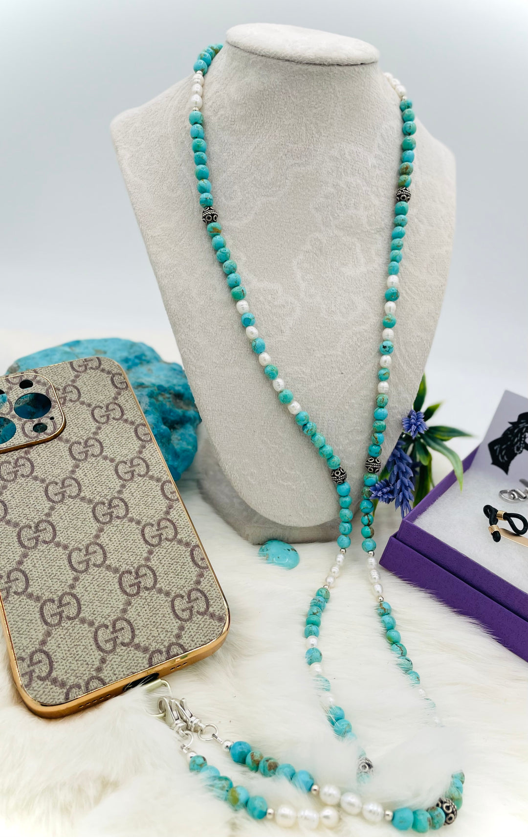 Beaded invention necklace featuring Kingman turquoise, freshwater pearls, sterling sliver accent beads, with sterling silver swivel lobsters, eye glasses loops, and cell phone case attachment bracket. Available only from Rockstar Cowgirl online or in store in Cody, Wyoming. 