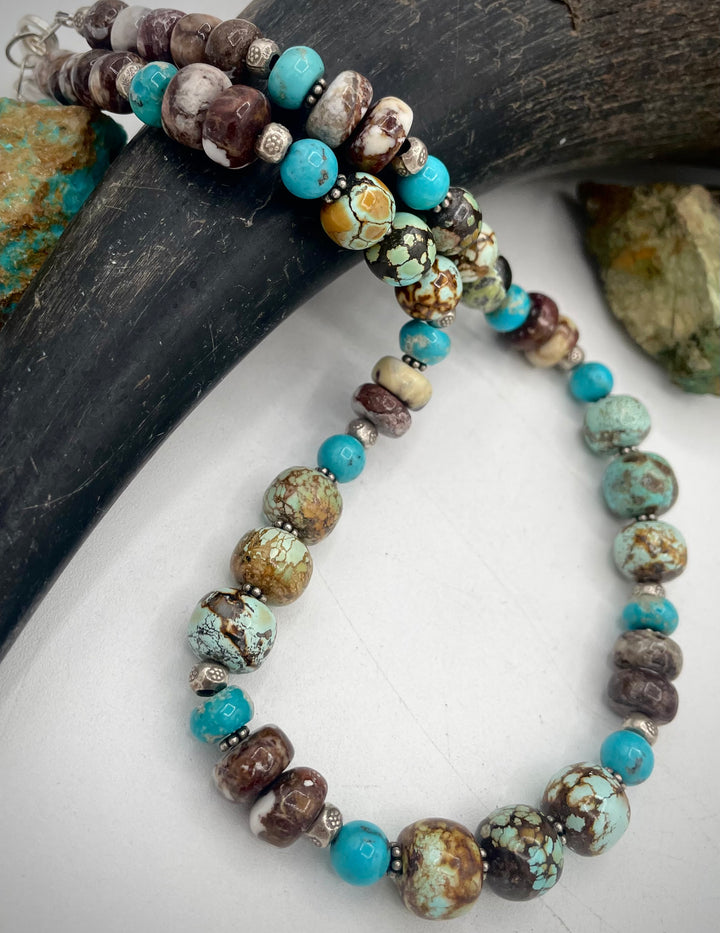 Handmade beaded necklace featuring natural cloud mountain Hubei turquoise, turquoise rounds, wild horse magnesite, and sterling silver beads. Available only from Rockstar Cowgirl online or in store in Cody, Wyoming.