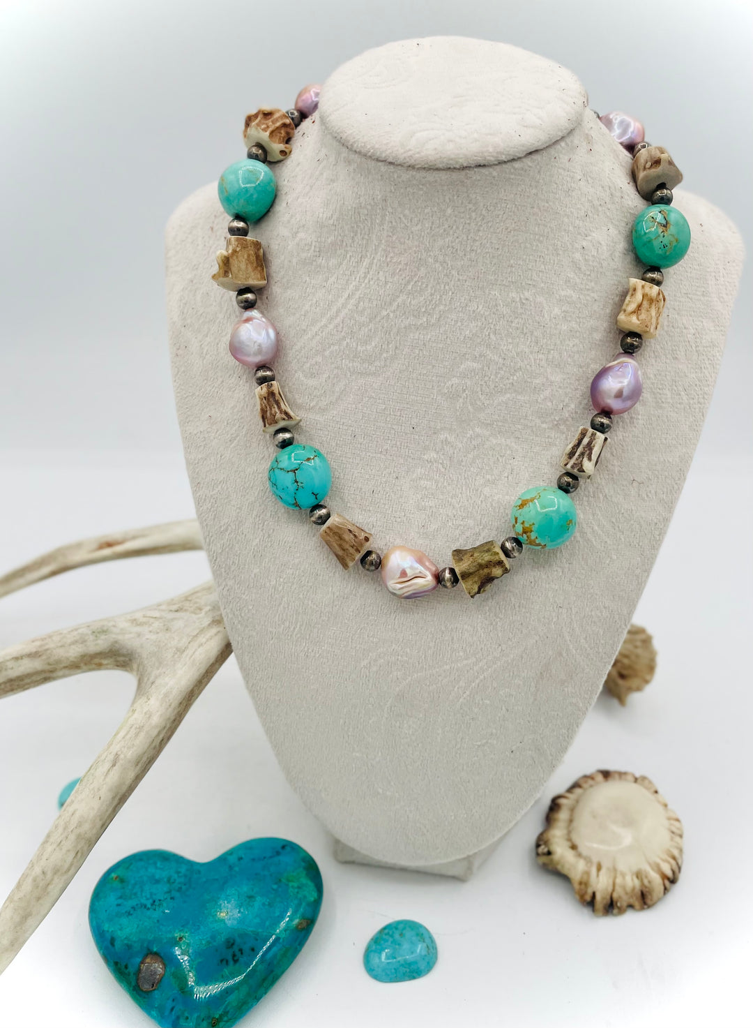Handmade beaded necklace featuring Kingman turquoise nuggets, deer antler beads, natural luster baroque pearls, and sterling silver beads. Available only from Rockstar Cowgirl online or in store in Cody, Wyoming.