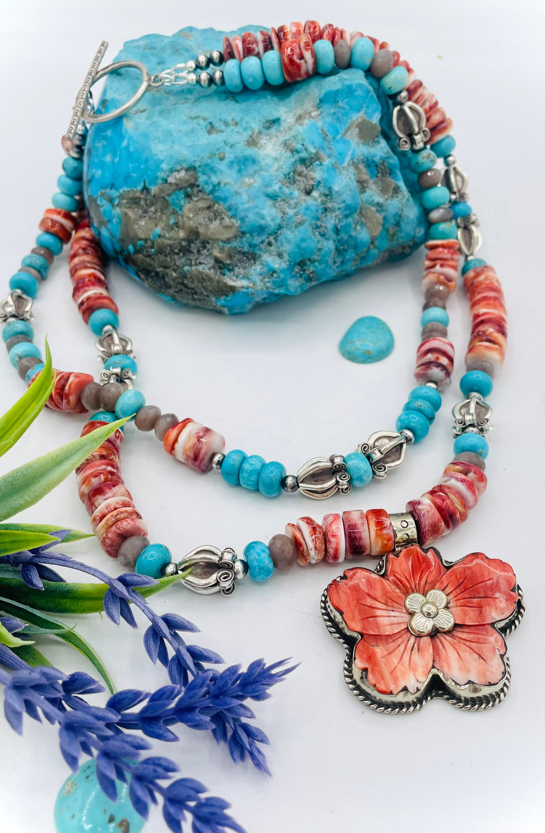 Beaded 2 strand necklace featuring spiny oyster, royal beauty turquoise, brown moonstone, and sterling silver beads with a spiny oyster flower pendent. Available only from Rockstar Cowgirl online or in store in Cody, Wyoming.