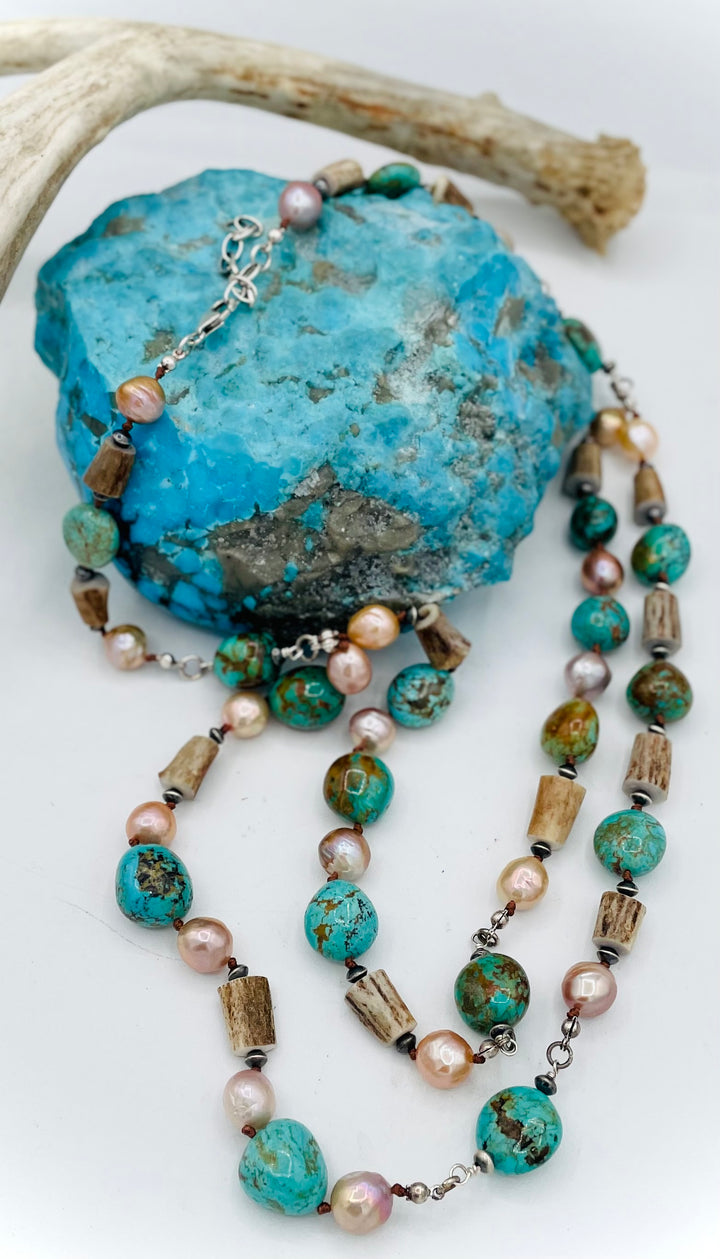 Silk knotted and wire wrapped treasure necklace with two nested strands featuring Kingman turquoise nuggets, deer antler beads, Edison natural luster pearls, and sterling silver beads. Available only from Rockstar Cowgirl online or in store in Cody, Wyoming.