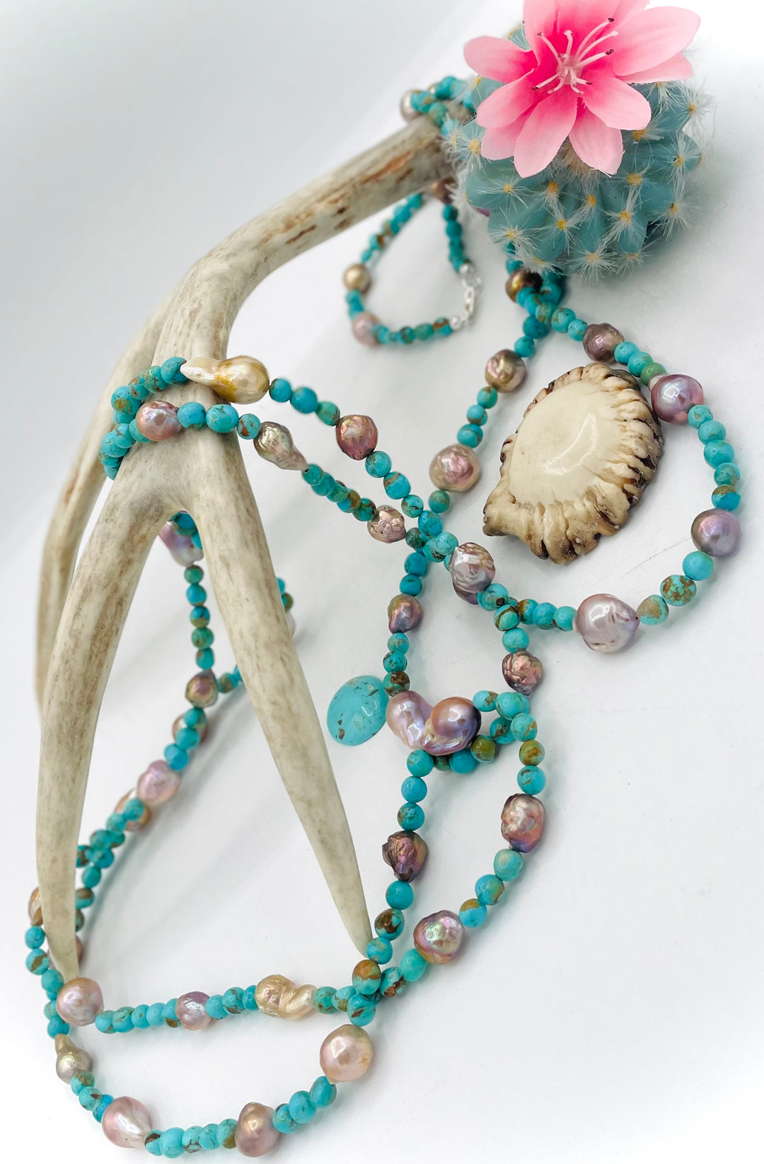 Handmade extra long beaded necklace featuring Kingman turquoise and natural luster baroque pearls. Available only from Rockstar Cowgirl online or in store in Cody, Wyoming. 