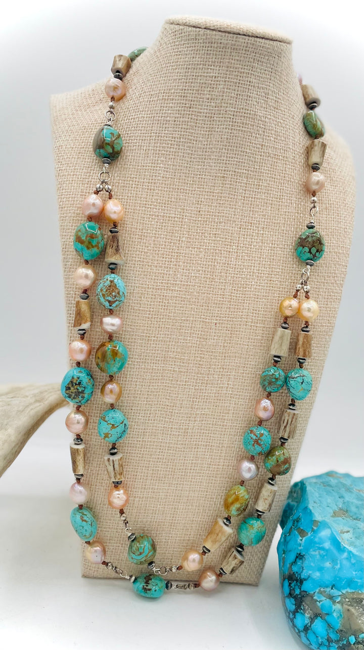 Silk knotted and wire wrapped treasure necklace with two nested strands featuring Kingman turquoise nuggets, deer antler beads, Edison natural luster pearls, and sterling silver beads. Available only from Rockstar Cowgirl online or in store in Cody, Wyoming.