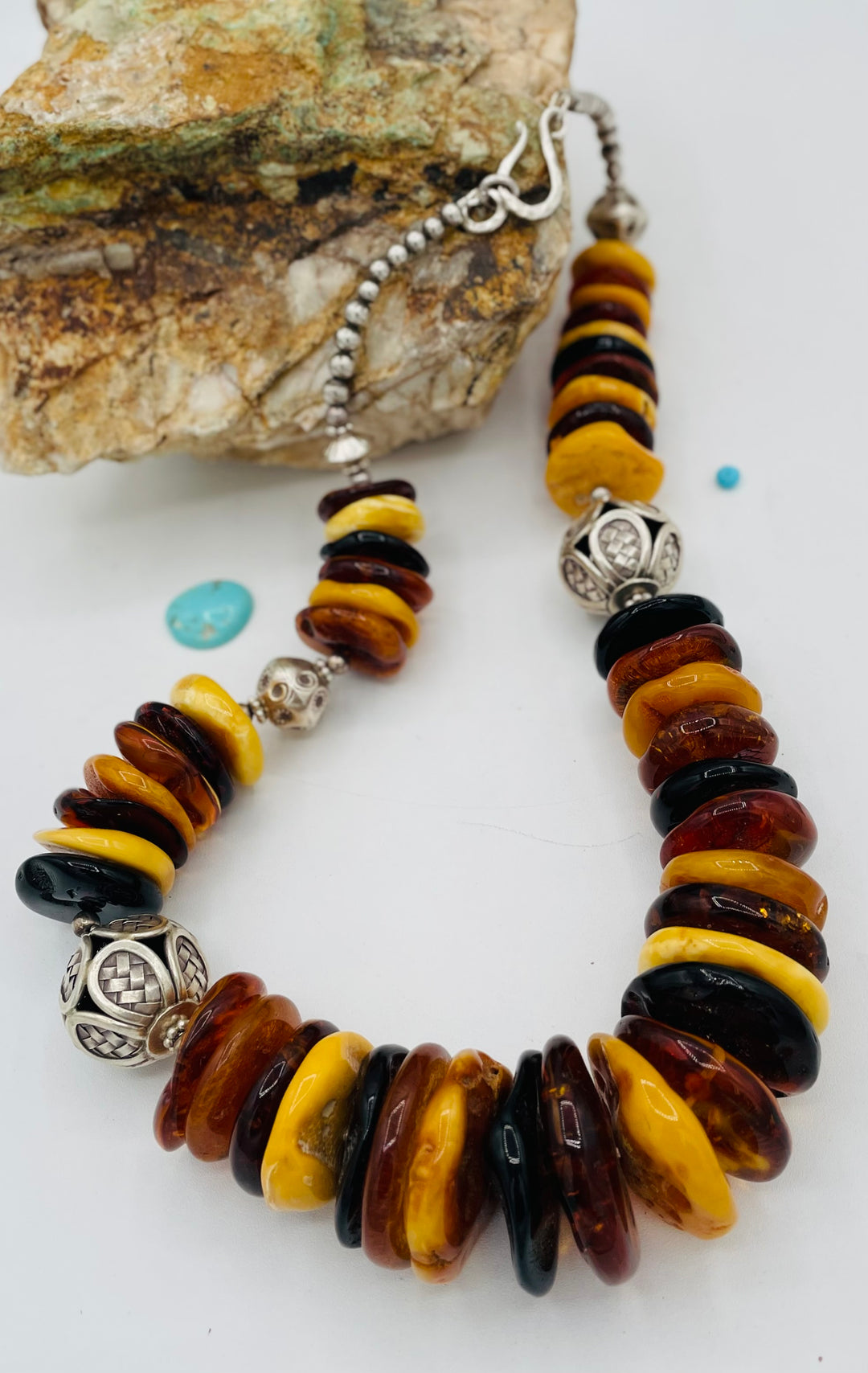 Beaded necklace featuring multi colored Baltic amber discs an handmade sterling silver beads. Available only from Rockstar Cowgirl online or in store in Cody, Wyoming.