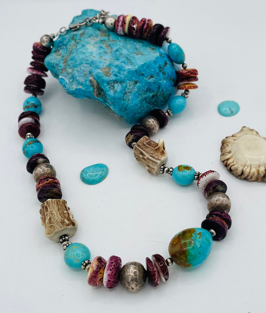 Beaded necklace featuring Antler beads, purple spiney oyster, Kingman turquoise nuggets, and sterling silver beads. Available only from Rockstar Cowgirl online or in store in Cody, Wyoming.