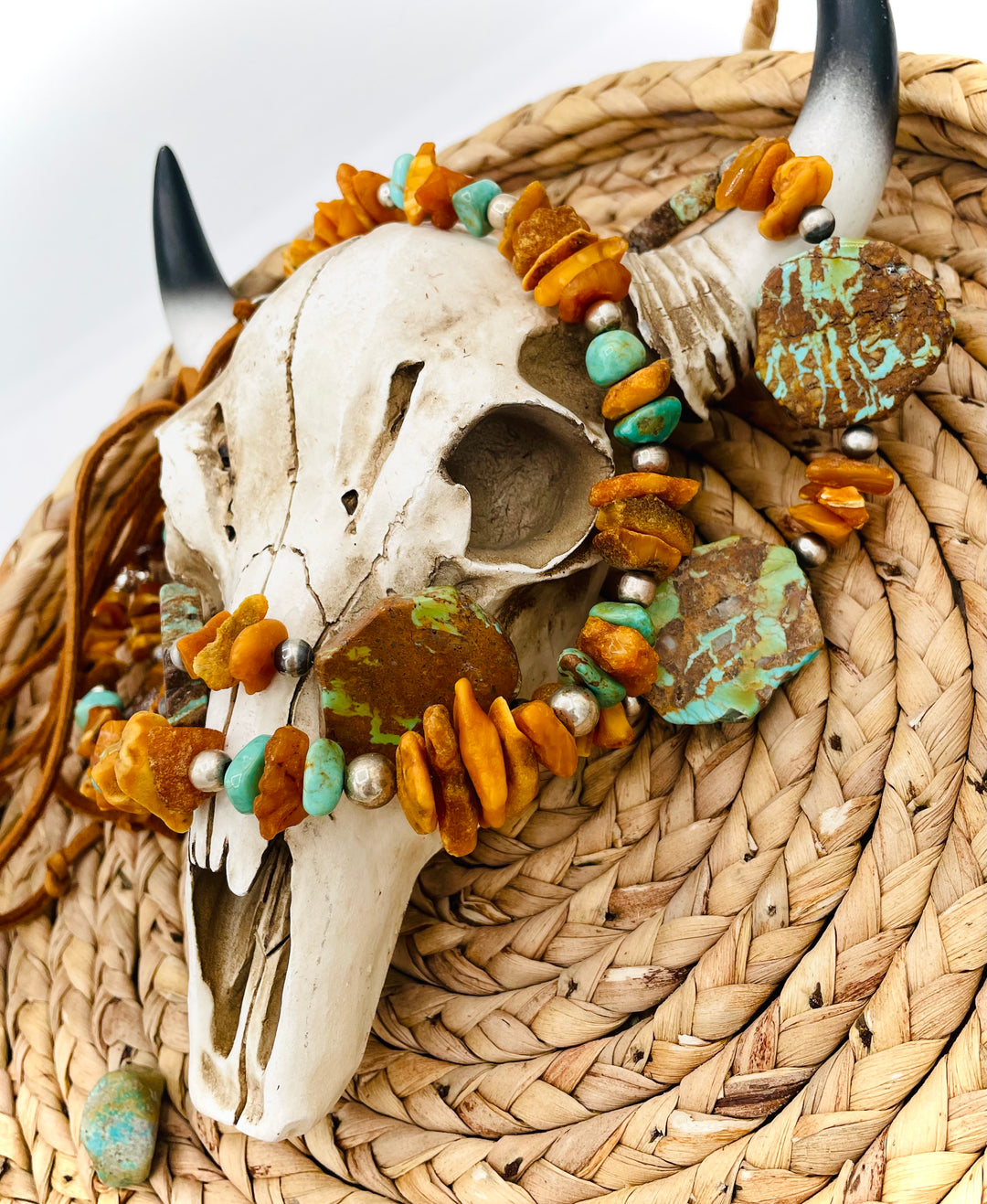 Beaded three strand necklace featuring Kingman turquoise, butterscotch amber, sterling silver beads, deer lace, and slide bead. Includes matching earrings. Available only from Rockstar Cowgirl online or in store in Cody, Wyoming.
