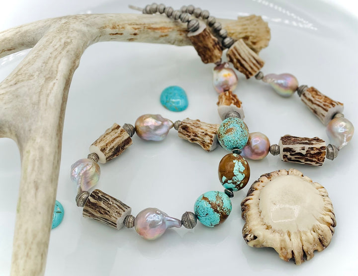 Handmade beaded necklace featuring textured deer antler beads, #8 turquoise nuggets, natural luster flameball pearls, and sterling silver beads. Available only from Rockstar Cowgirl online or in store in Cody, Wyoming. 