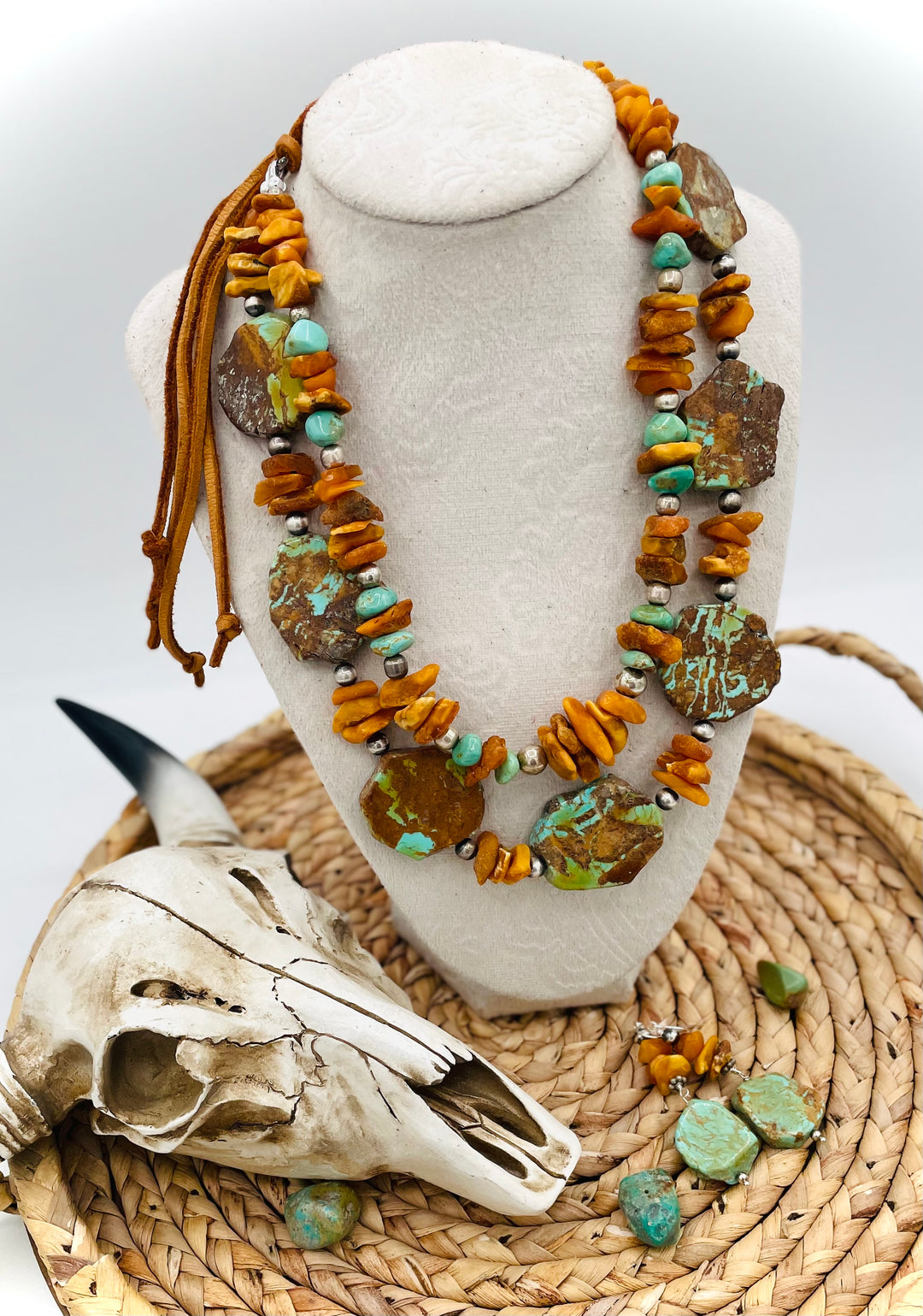 Beaded three strand necklace featuring Kingman turquoise, butterscotch amber, sterling silver beads, deer lace, and slide bead. Includes matching earrings. Available only from Rockstar Cowgirl online or in store in Cody, Wyoming.