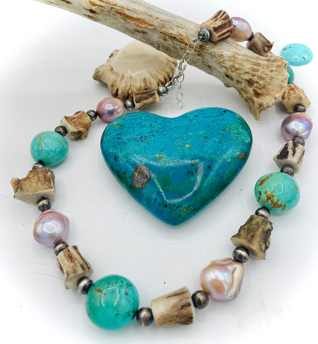 Handmade beaded necklace featuring Kingman turquoise nuggets, deer antler beads, natural luster baroque pearls, and sterling silver beads. Available only from Rockstar Cowgirl online or in store in Cody, Wyoming.