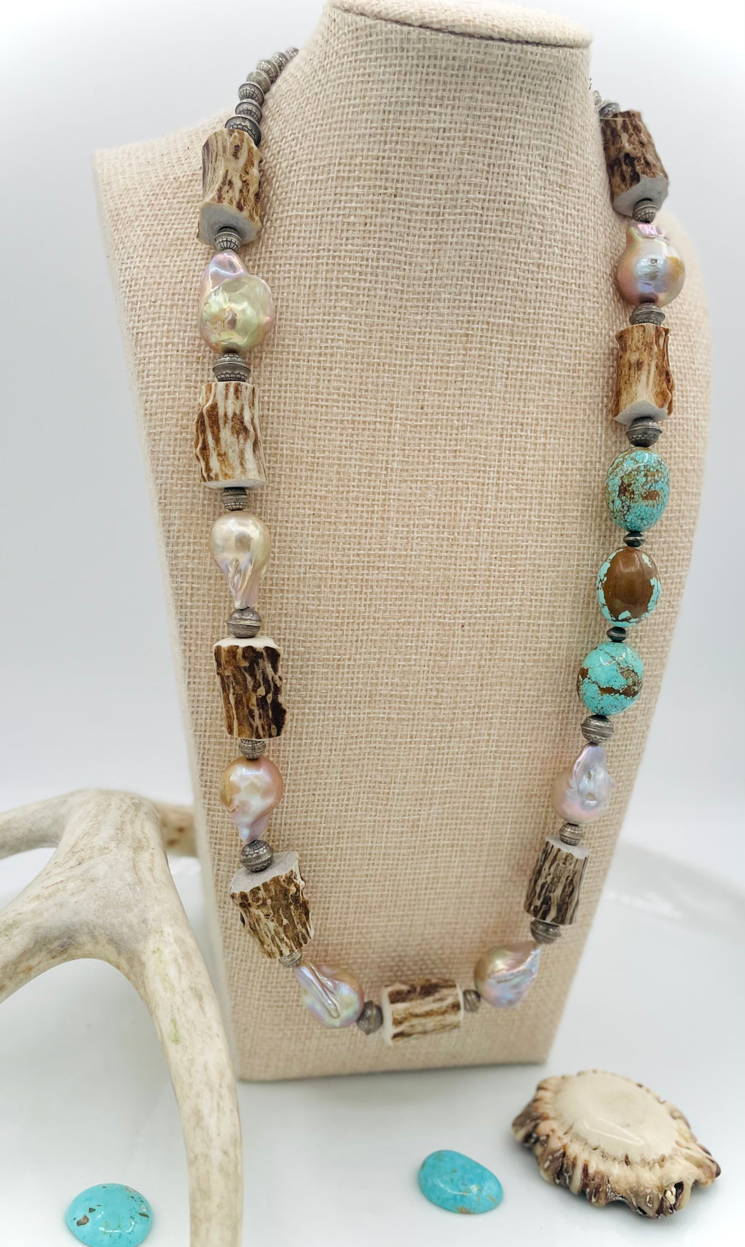 Handmade beaded necklace featuring textured deer antler beads, #8 turquoise nuggets, natural luster flameball pearls, and sterling silver beads. Available only from Rockstar Cowgirl online or in store in Cody, Wyoming. 