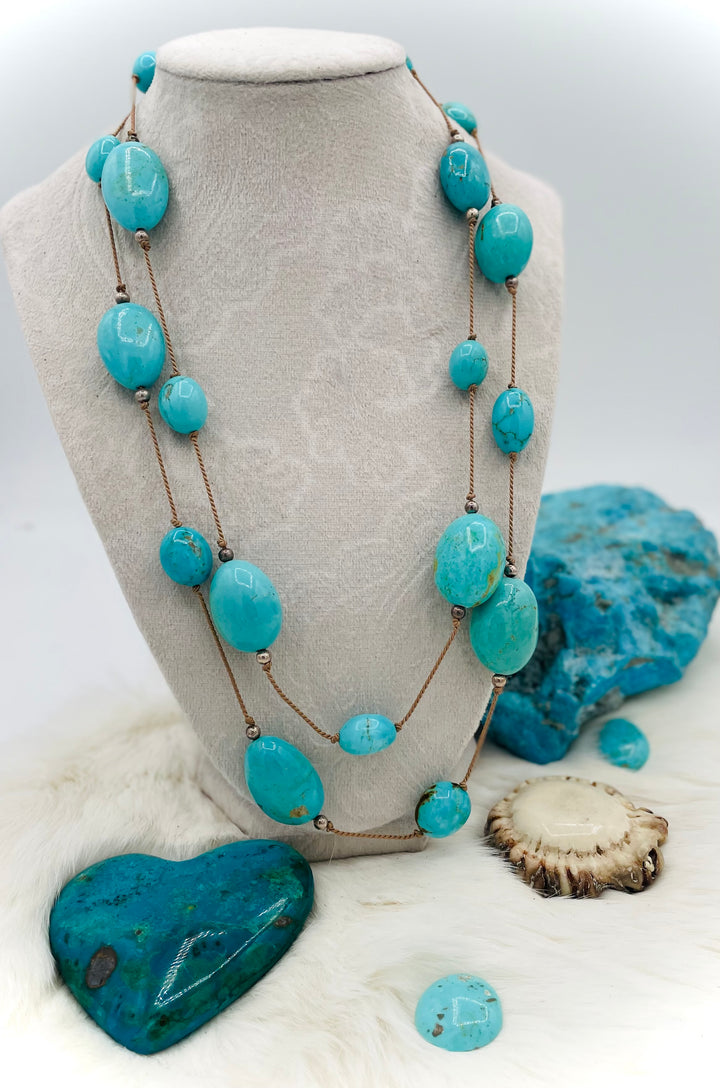 Silk knotted necklace featuring Kingman turquoise nuggets and sterling silver rounds on silk cord. Available only from Rockstar Cowgirl online or in store in Cody, Wyoming.
