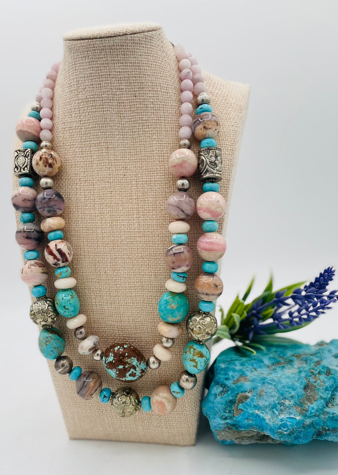Adjustable beaded necklace featuring Pink opal, Royal beauty turquoise, Serling silver beads, Kingman turquoise, Repousse beads, pink morganite, number 8 turquoise nuggets, and finished with deer leather lace. Available only from Rockstar Cowgirl online or in store in Cody, Wyoming.