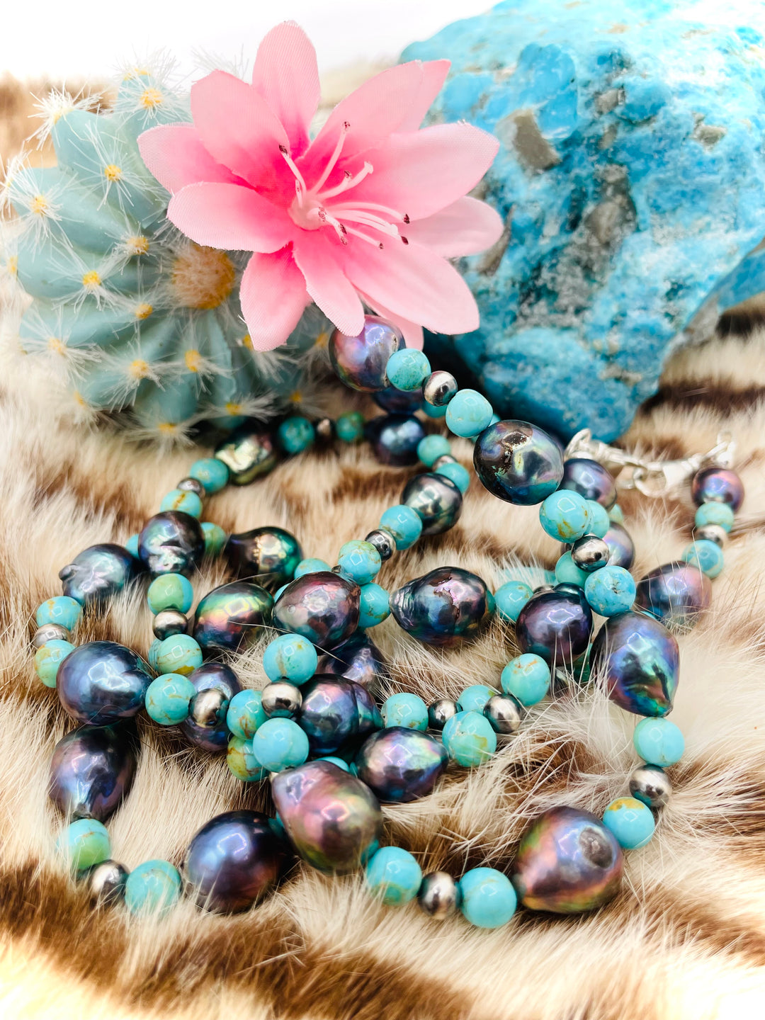 Beaded invention necklace featuring Kingman turquoise, peacock pearls, sterling silver beads, sterling silver swivel lobsters, eyeglass loops, and cell phone case attachment bracket. Available only from Rockstar Cowgirl online or in store in Cody, Wyoming. 