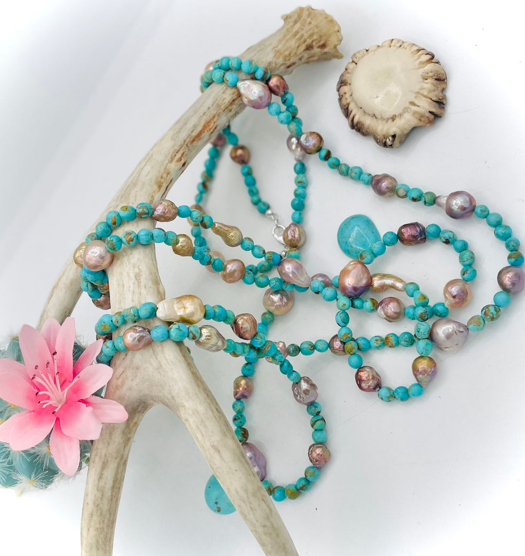 Handmade extra long beaded necklace featuring Kingman turquoise and natural luster baroque pearls. Available only from Rockstar Cowgirl online or in store in Cody, Wyoming. 