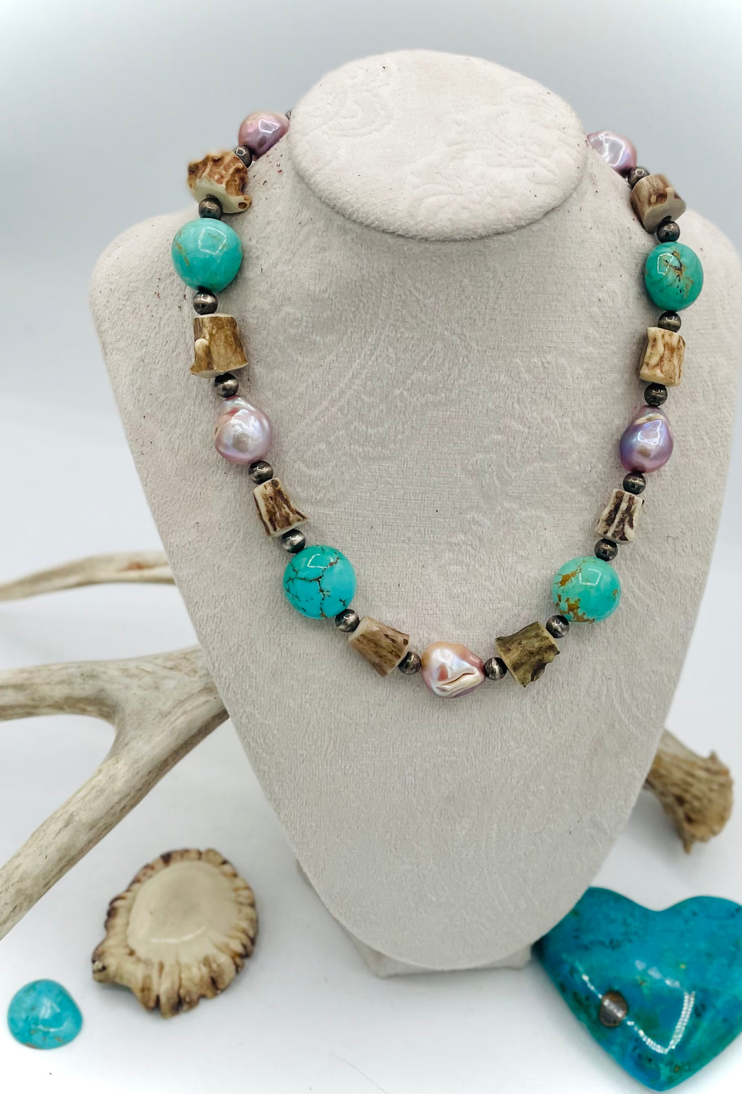 Handmade beaded necklace featuring Kingman turquoise nuggets, deer antler beads, natural luster baroque pearls, and sterling silver beads. Available only from Rockstar Cowgirl online or in store in Cody, Wyoming.