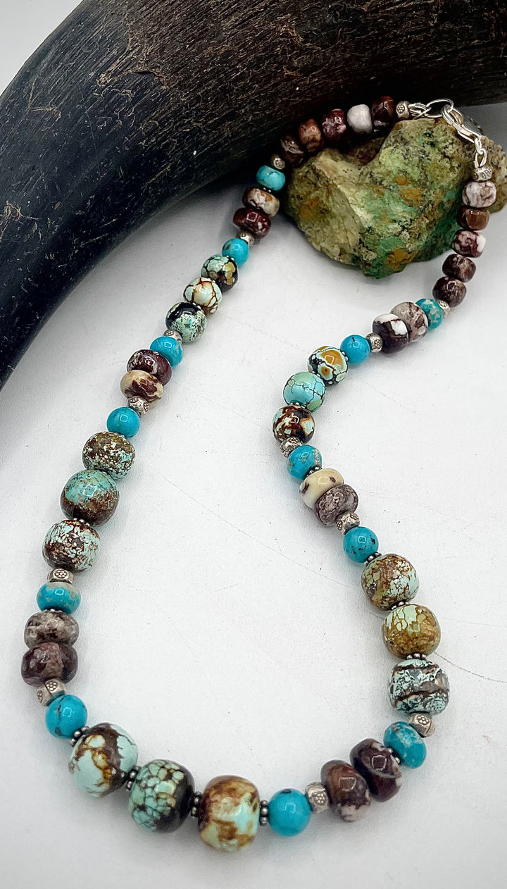 Handmade beaded necklace featuring natural cloud mountain Hubei turquoise, turquoise rounds, wild horse magnesite, and sterling silver beads. Available only from Rockstar Cowgirl online or in store in Cody, Wyoming.