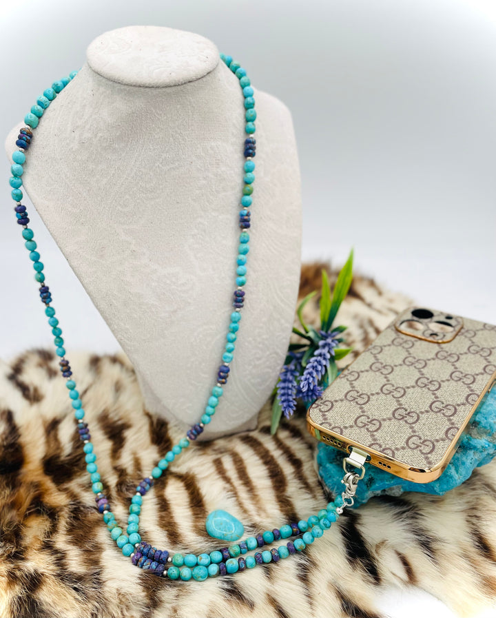 Beaded invention necklace featuring Kingman turquoise, purple Mojave turquoise, sterling silver beads, sterling silver swivel lobsters, eye glasses loops, cell phone case attachment bracket. Available only from Rockstar Cowgirl online or in store in Cody, Wyoming.