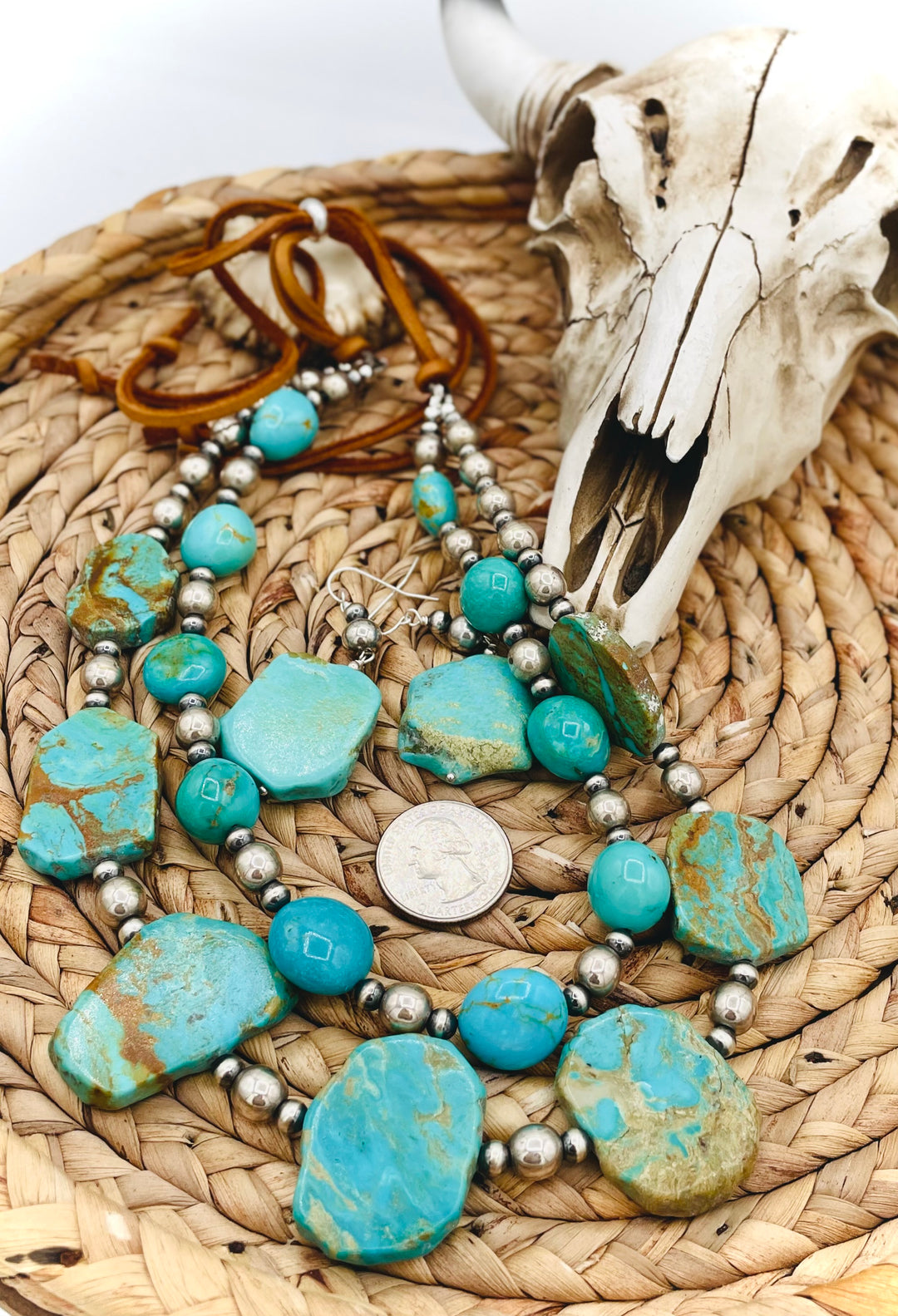 Beaded two strand necklace featuring Kingman turquoise and sterling silver beads and finished with  deer lace and slide bead. Including matching earrings. U.S. quarter for size reference. Available only from Rockstar Cowgirl online or in store in Cody, Wyoming.