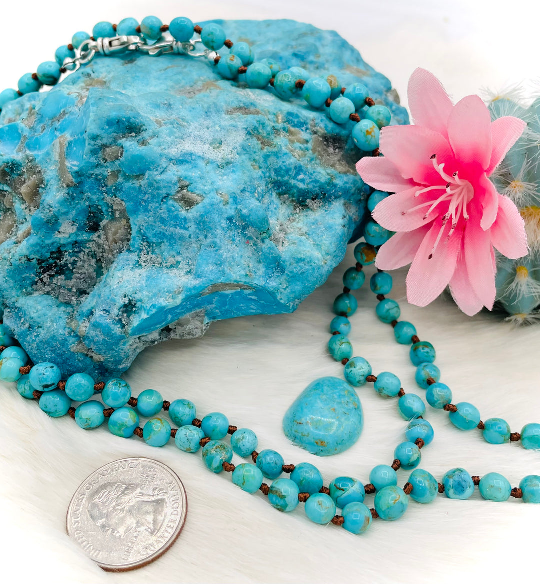 Silk knotted Kingman turquoise necklace, phone holder strap, or eyeglass holder featuring sterling silver swivel lobsters for various attachments or uses. Comes with phone case attachments and eye glasses loops. U.S. quarter for size reference. Available only from Rockstar Cowgirl online or in store in Cody, Wyoming.