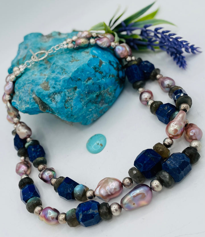 Beaded double stranded necklace featuring lapis, natural luster baroque pearls, labradorite, and sterling silver beads. Matching earrings included. Available only from Rockstar Cowgirl online or in store in Cody, Wyoming.