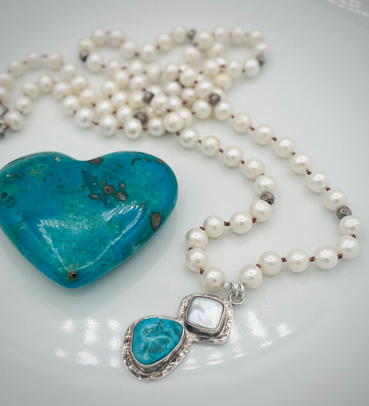 Silk knotted long necklace featuring white pearls, and sterling silver beads with a pearl and turquoise sterling silver pendent. Available only from Rockstar Cowgirl online or in store in Cody, Wyoming.