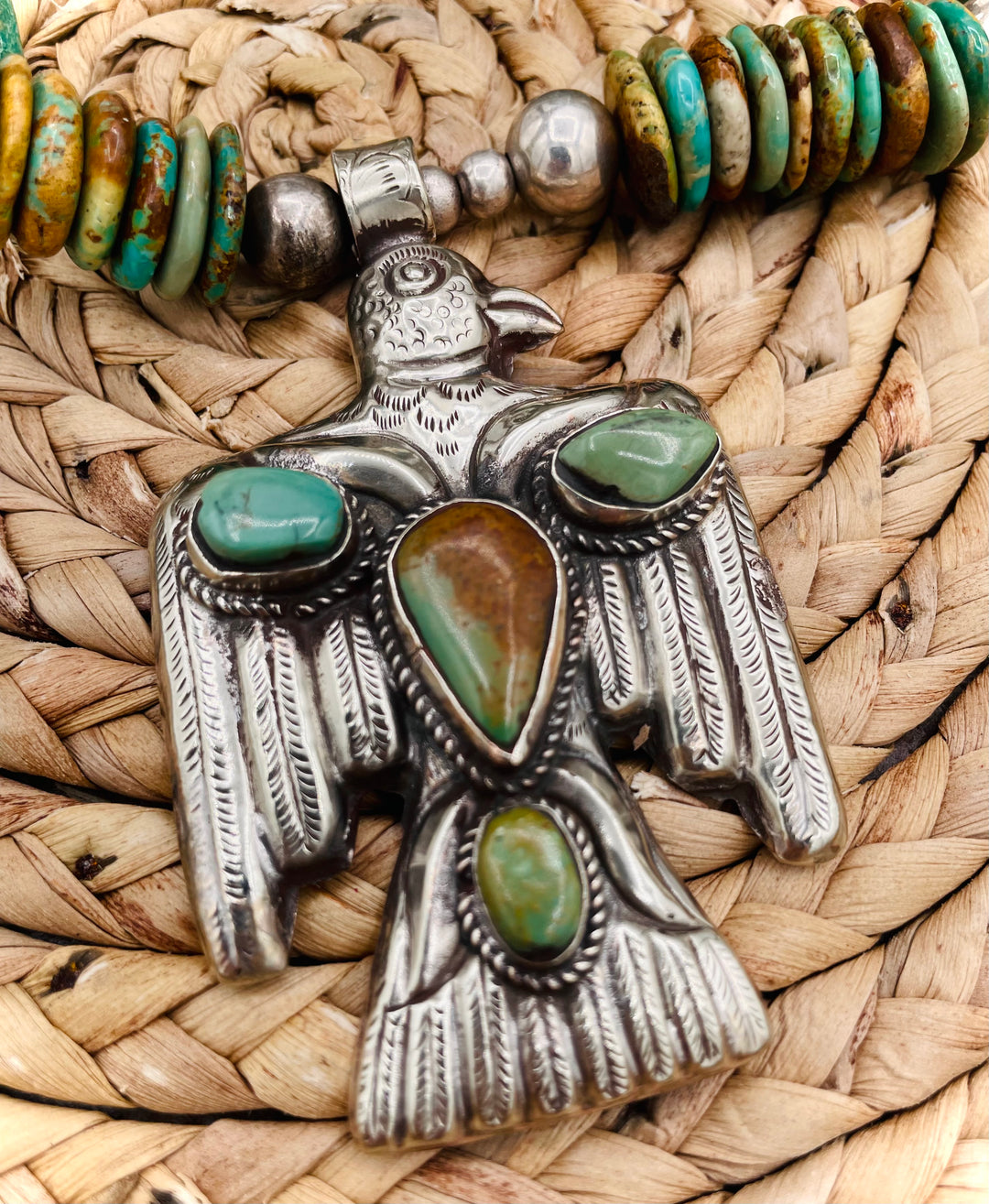 Handmade turquoise necklace featuring  turquoise discs, sterling silver accents, and Tibetan silver pendent. Available only from Rockstar Cowgirl online or in store in Cody, Wyoming.