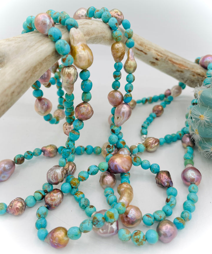 Handmade extra long beaded necklace featuring Kingman turquoise and natural luster baroque pearls. Available only from Rockstar Cowgirl online or in store in Cody, Wyoming. 