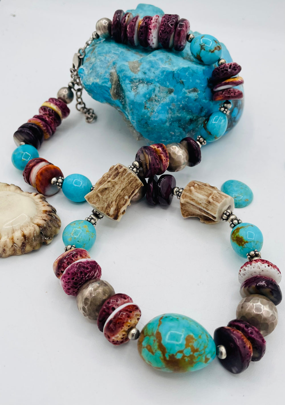 Beaded necklace featuring Antler beads, purple spiney oyster, Kingman turquoise nuggets, and sterling silver beads. Available only from Rockstar Cowgirl online or in store in Cody, Wyoming.