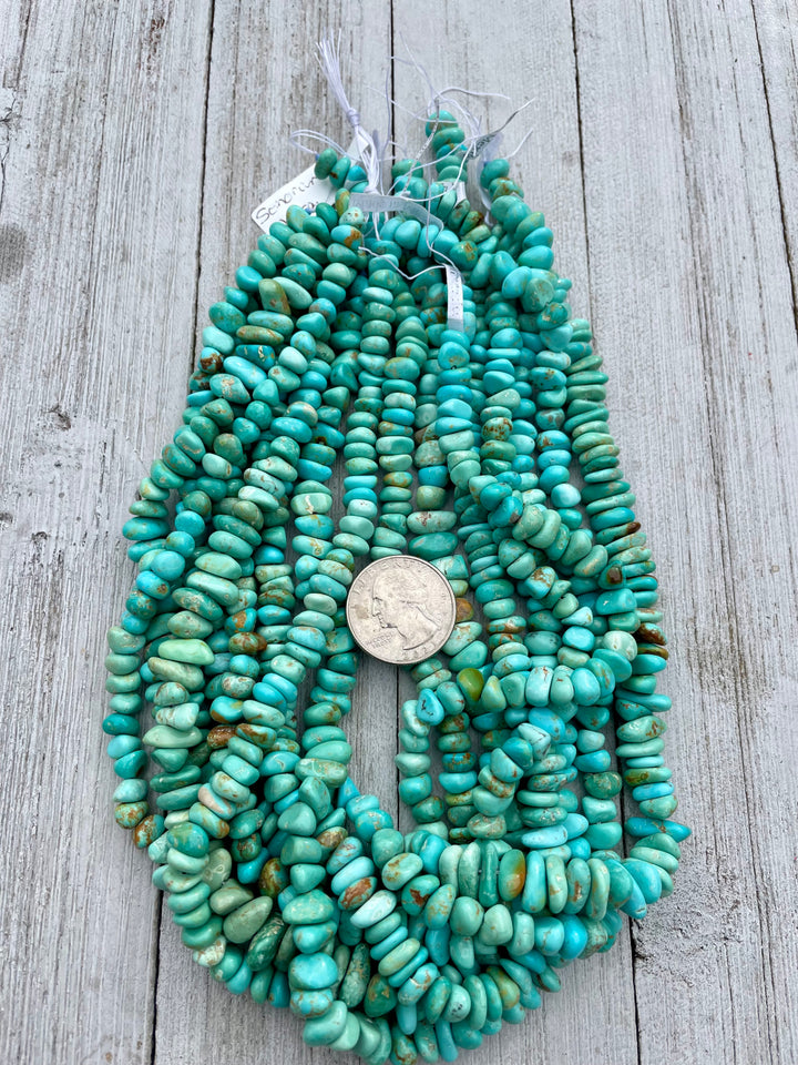 Blue Green center drilled nugget strands sold individually. U. S. quarter for size reference. Available only from Rockstar Cowgirl online or in store in Cody, Wyoming.