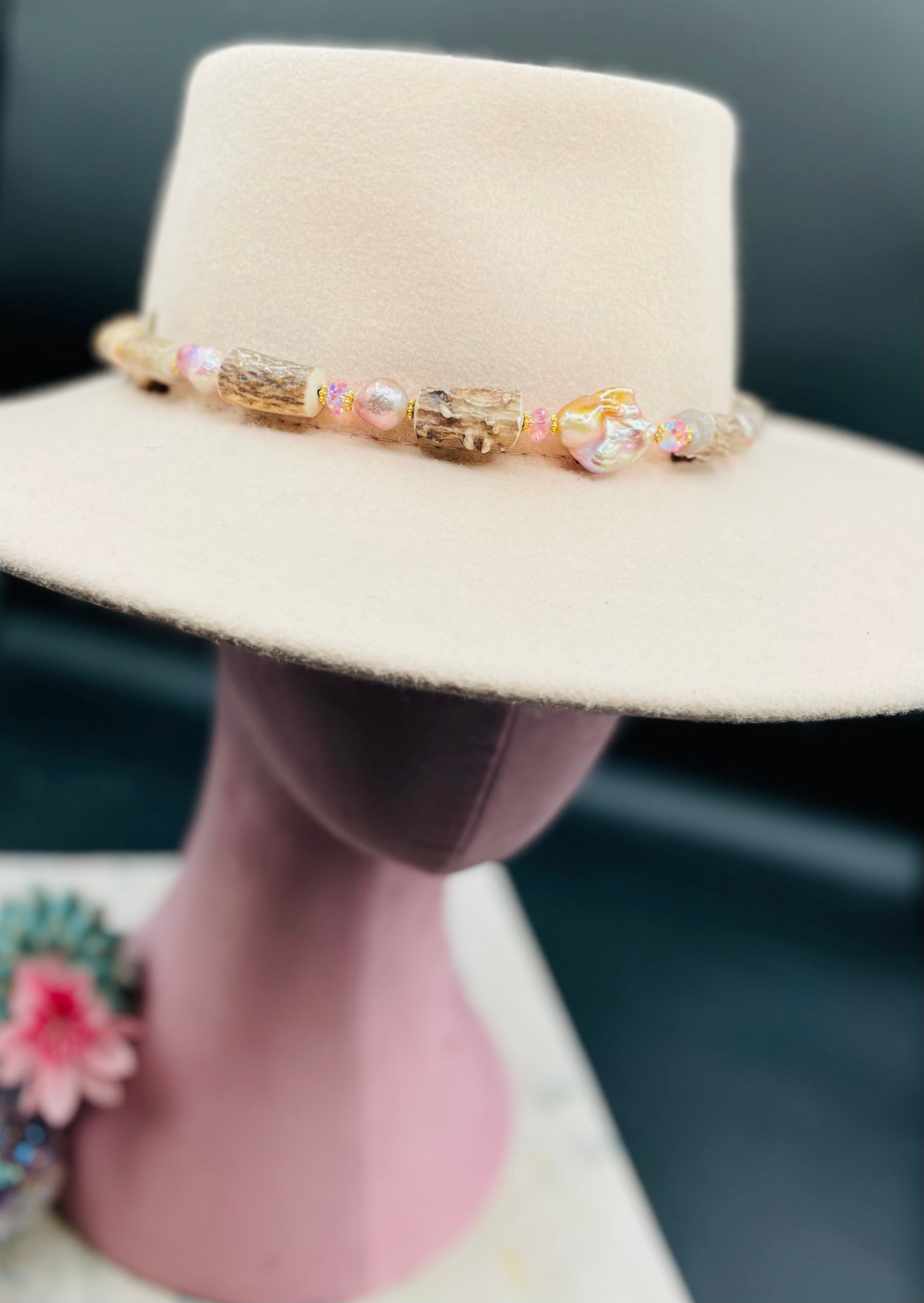 Baroque natural luster pearl, knobby deer antlers beads and vintage Swarovski crystal hatband. Finished with Deer lace and slide bead for adjustability. Available only from Rockstar Cowgirl online or in store in Cody, Wyoming.