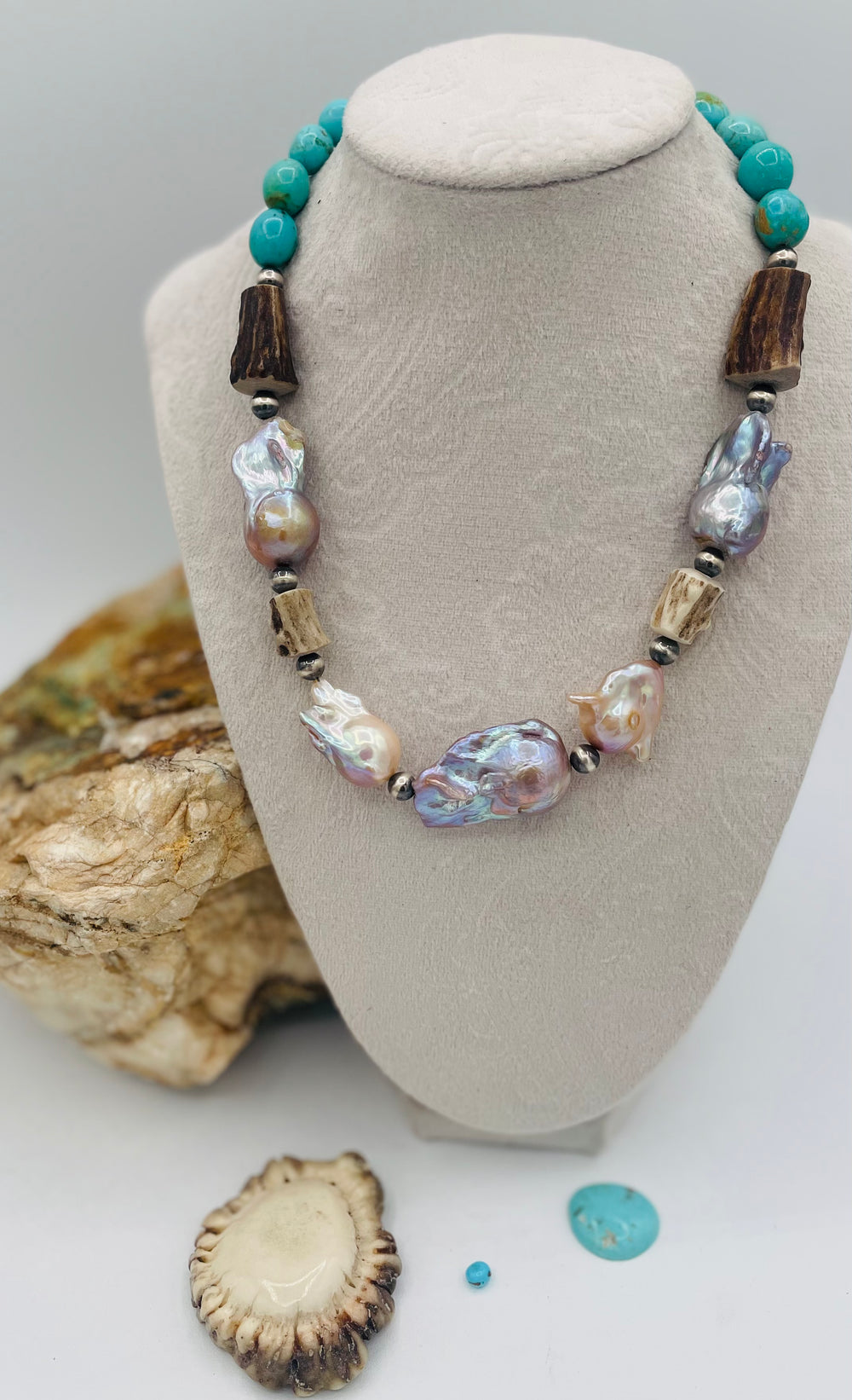 Beaded necklace featuring Flame ball natural luster baroque pearls, deer antler, Kingman turquoise nuggets, and sterling silver beads. Available only from Rockstar Cowgirl online or in store in Cody, Wyoming.