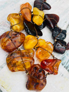 Large slabs of Baltic amber silk knotted with bronze sprinkled through out and bronze hook clasp.  Available only from Rockstar Cowgirl online or in store in Cody, Wyoming.