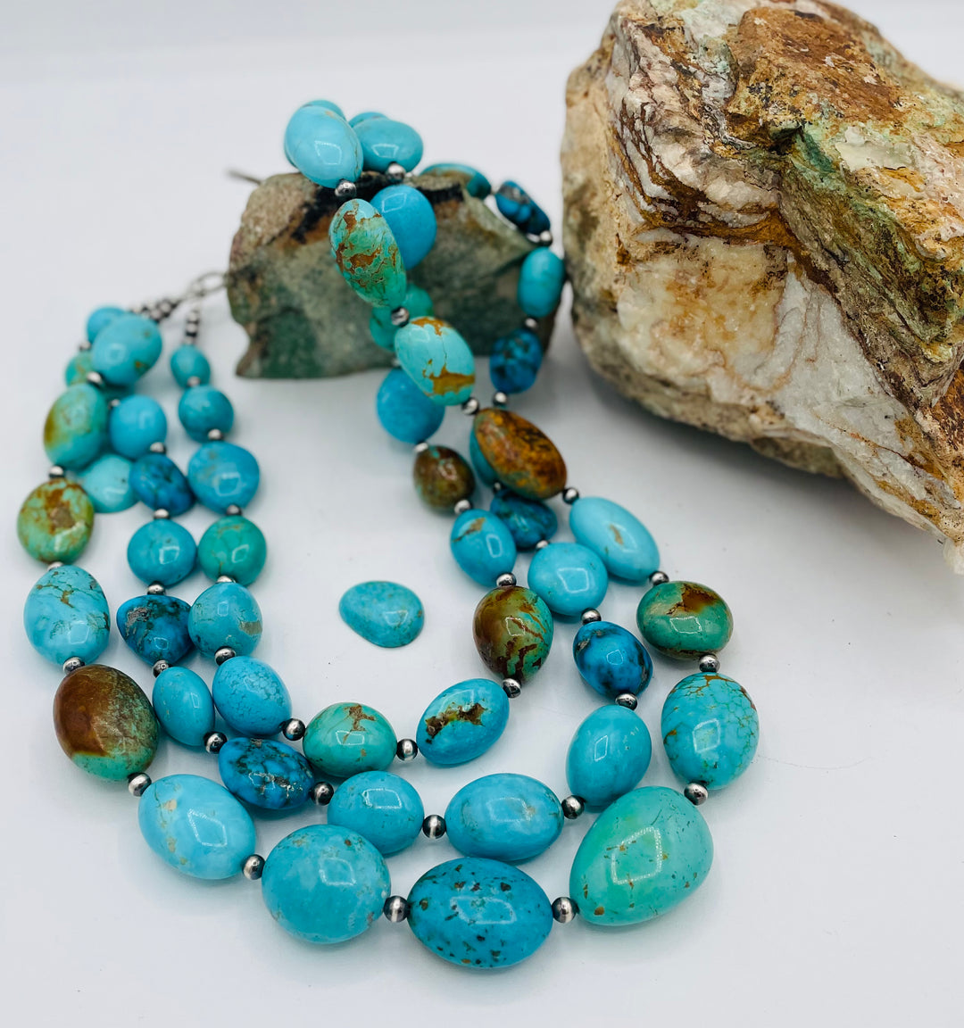 3 strand beaded necklace featuring Kingman turquoise in blues and greens with sterling silver Navajo pearl beads. Available only from Rockstar Cowgirl online or in store in Cody, Wyoming.