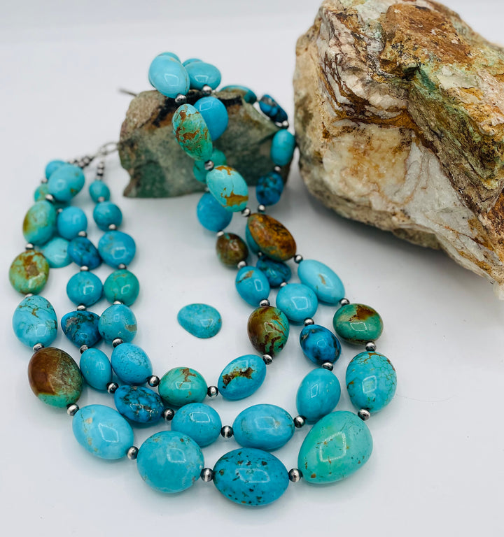 3 strand beaded necklace featuring Kingman turquoise in blues and greens with sterling silver Navajo pearl beads. Available only from Rockstar Cowgirl online or in store in Cody, Wyoming.