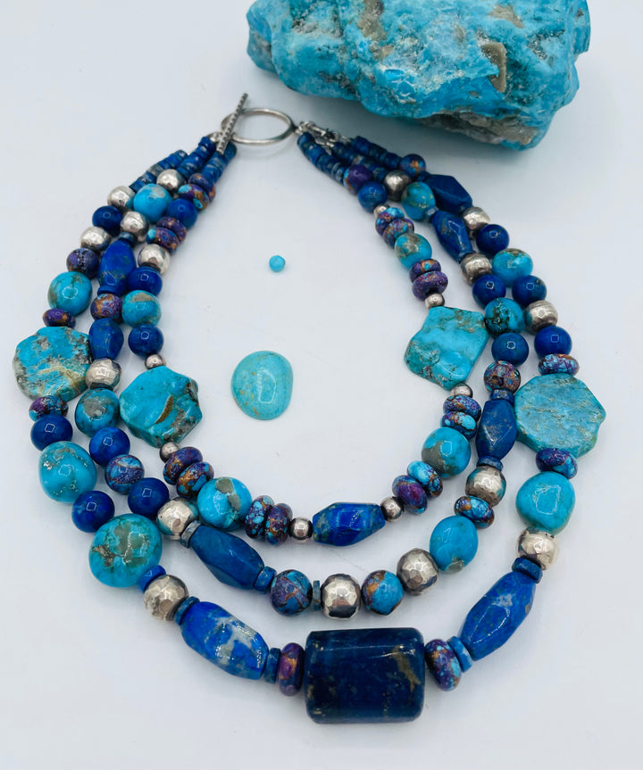 Chunky 3 strand beaded necklace featuring lapis, purple Mojave turquoise, sterling silver beads, Ithaca Peak turquoise, and Kingman turquoise. Available only from Rockstar Cowgirl online or in store in Cody, Wyoming.