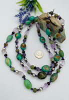 3 strand chunky necklace featuring green Kingman turquoise, African turquoise, brown opal, pink amethyst vintage sterling silver, cape amethyst, and dark amethyst. U.S. quarter for size reference. Available only rom Rockstar Cowgirl online or in store in Cody, Wyoming. 