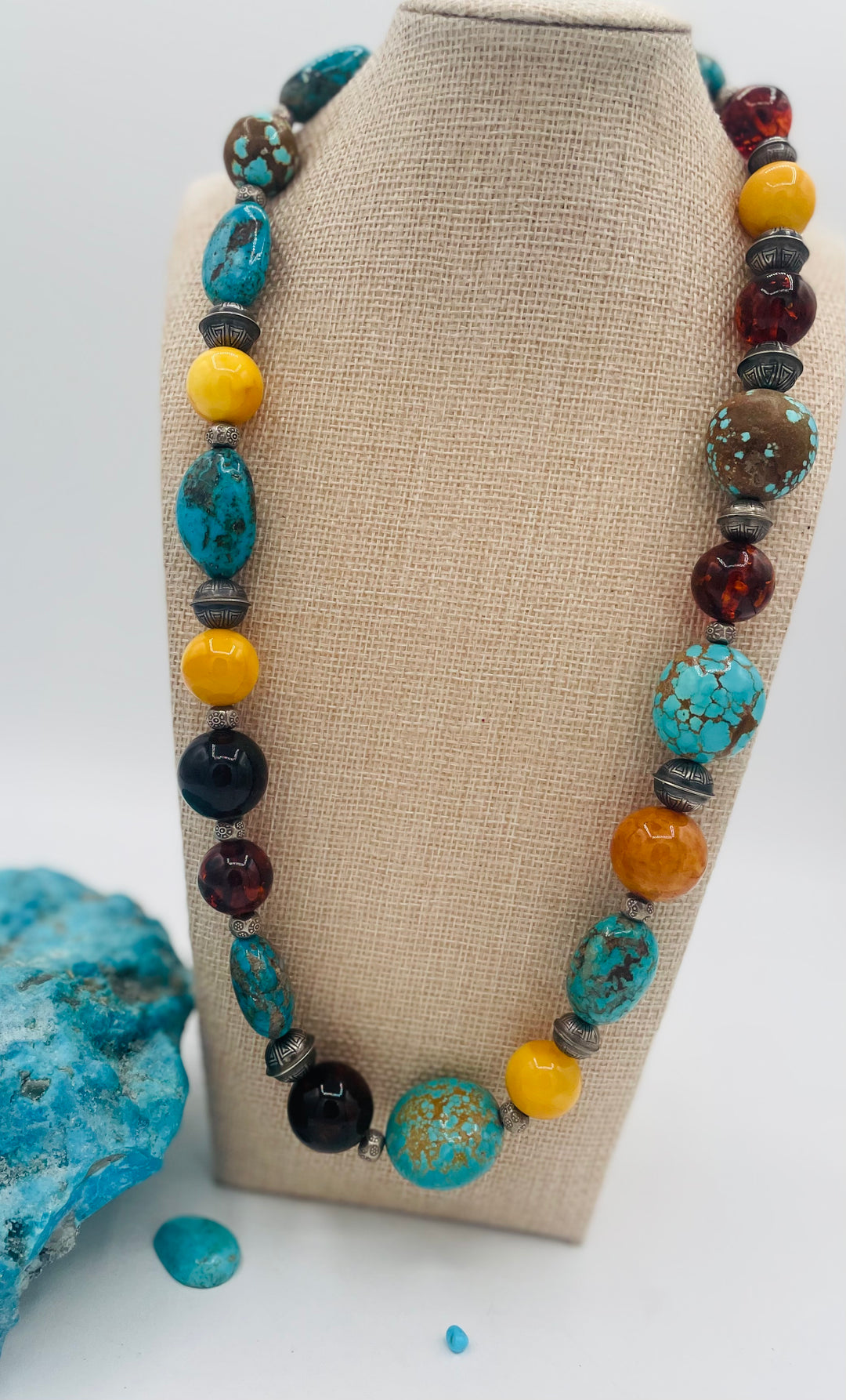 Beaded necklace featuring #8 turquoise, Ithaca Peak turquoise, Kingman turquoise, Baltic amber, and sterling silver beads. Available only from Rockstar Cowgirl online or in store in Cody, Wyoming. 