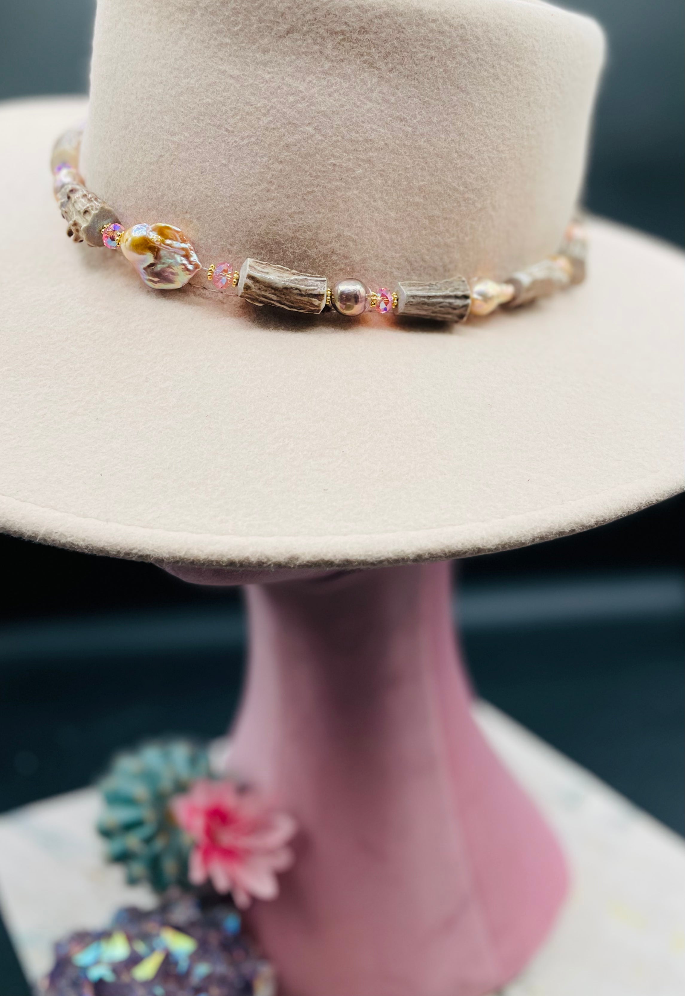 Baroque natural luster pearl, knobby deer antlers beads and vintage Swarovski crystal hatband. Finished with Deer lace and slide bead for adjustability. Available only from Rockstar Cowgirl online or in store in Cody, Wyoming.