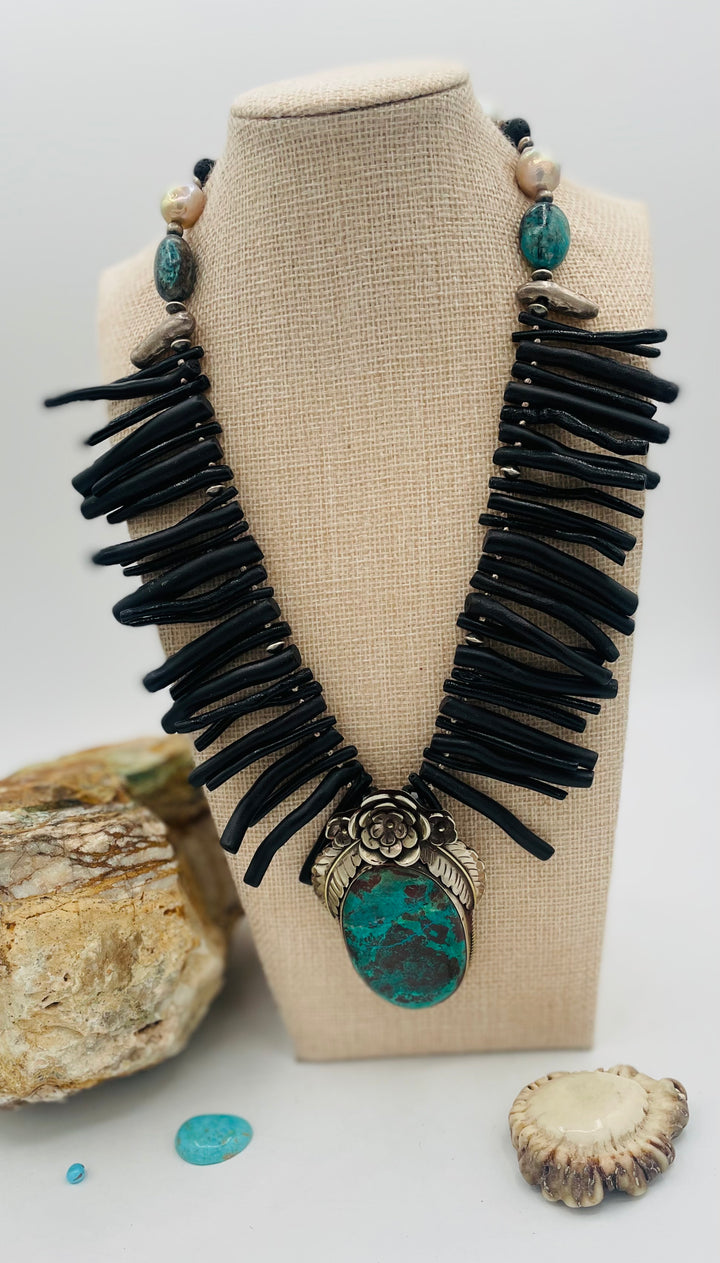 Beaded necklace featuring black coral sticks, smokey Kingman turquoise, sterling silver beads, lava, natural luster pearls, with a chrysocolla and Bali silver pendent. Available only from Rockstar Cowgirl online or in store in Cody, Wyoming.