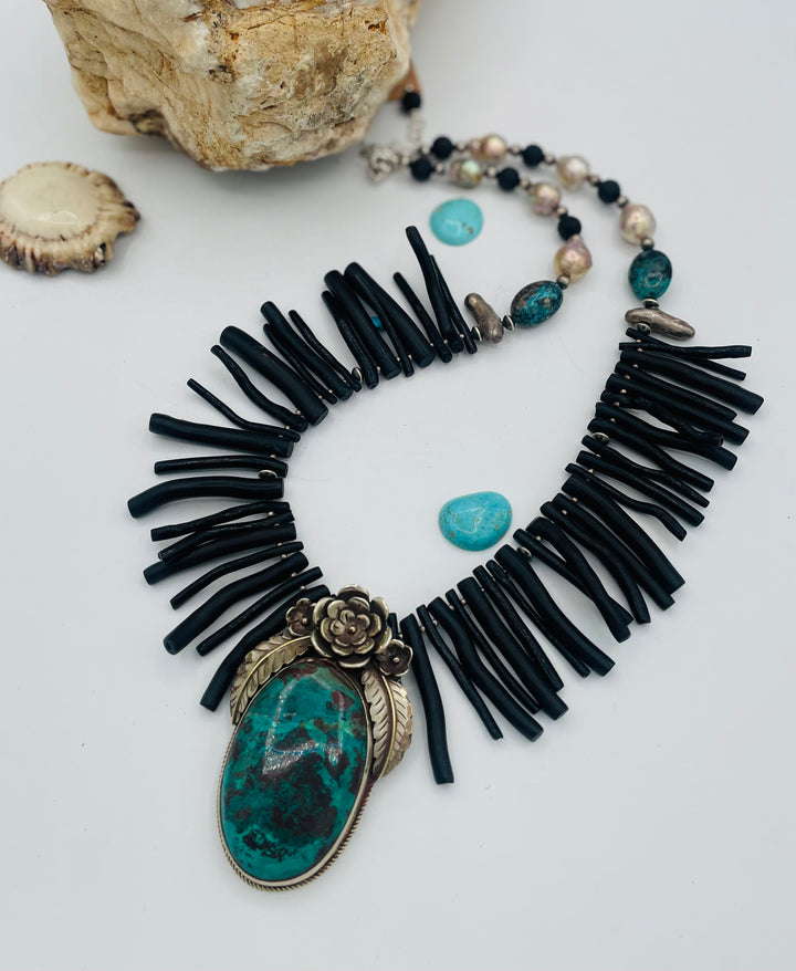 Beaded necklace featuring black coral sticks, smokey Kingman turquoise, sterling silver beads, lava, natural luster pearls, with a chrysocolla and Bali silver pendent. Available only from Rockstar Cowgirl online or in store in Cody, Wyoming.