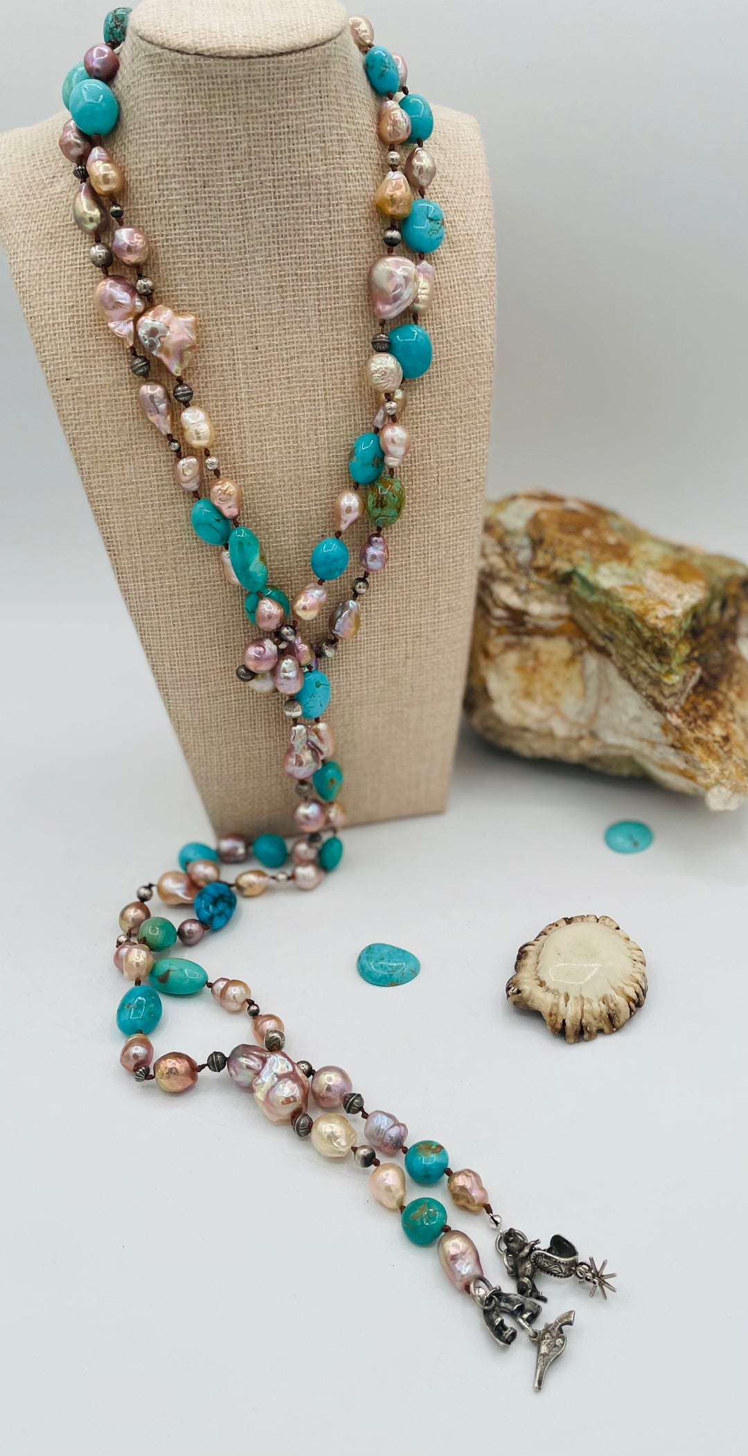 Silk knotted lariat necklace featuring baroque natural luster pearls, Kingman turquoise nuggets, and sterling silver beads. Available only from Rockstar Cowgirl online or in store in Cody, Wyoming.