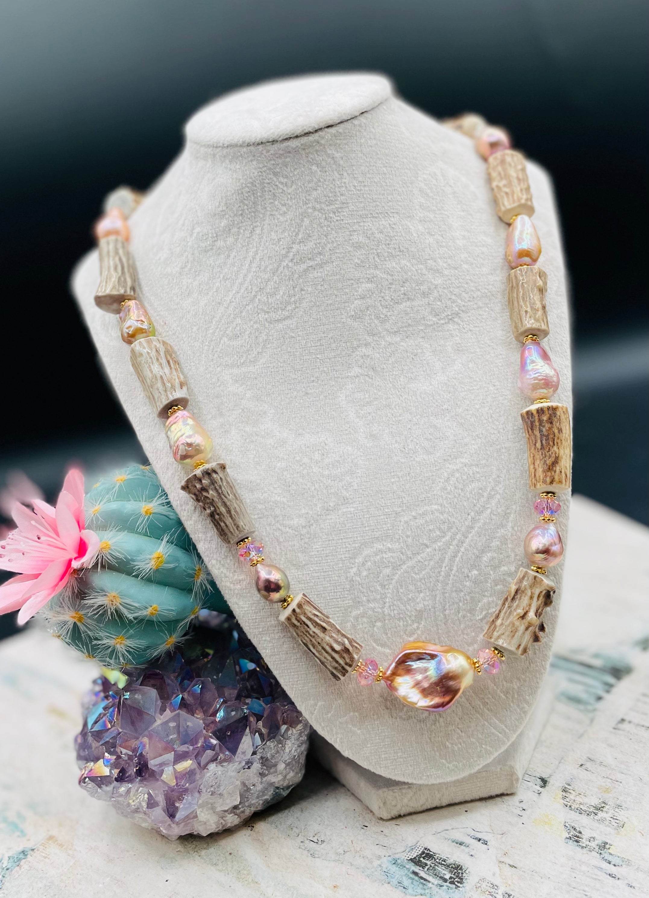 Baroque natural luster pearl, knobby deer antlers beads and vintage Swarovski crystal hatband. Finished with Deer lace and slide bead for adjustability. Available only from Rockstar Cowgirl online or in store in Cody, Wyoming.